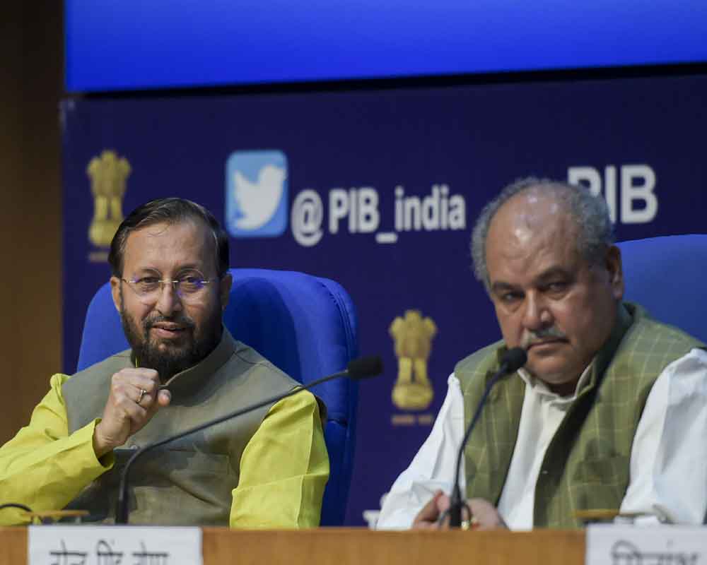 Union Minister for Environment, Forest & Climate Change and Information & Broadcasting Prakash Javadekar and Minister for Agriculture and Farmers’ Welfare Narendra Singh Tomar brief the media on the Cabinet meeting, at National Media Centre, New Delhi - PTI