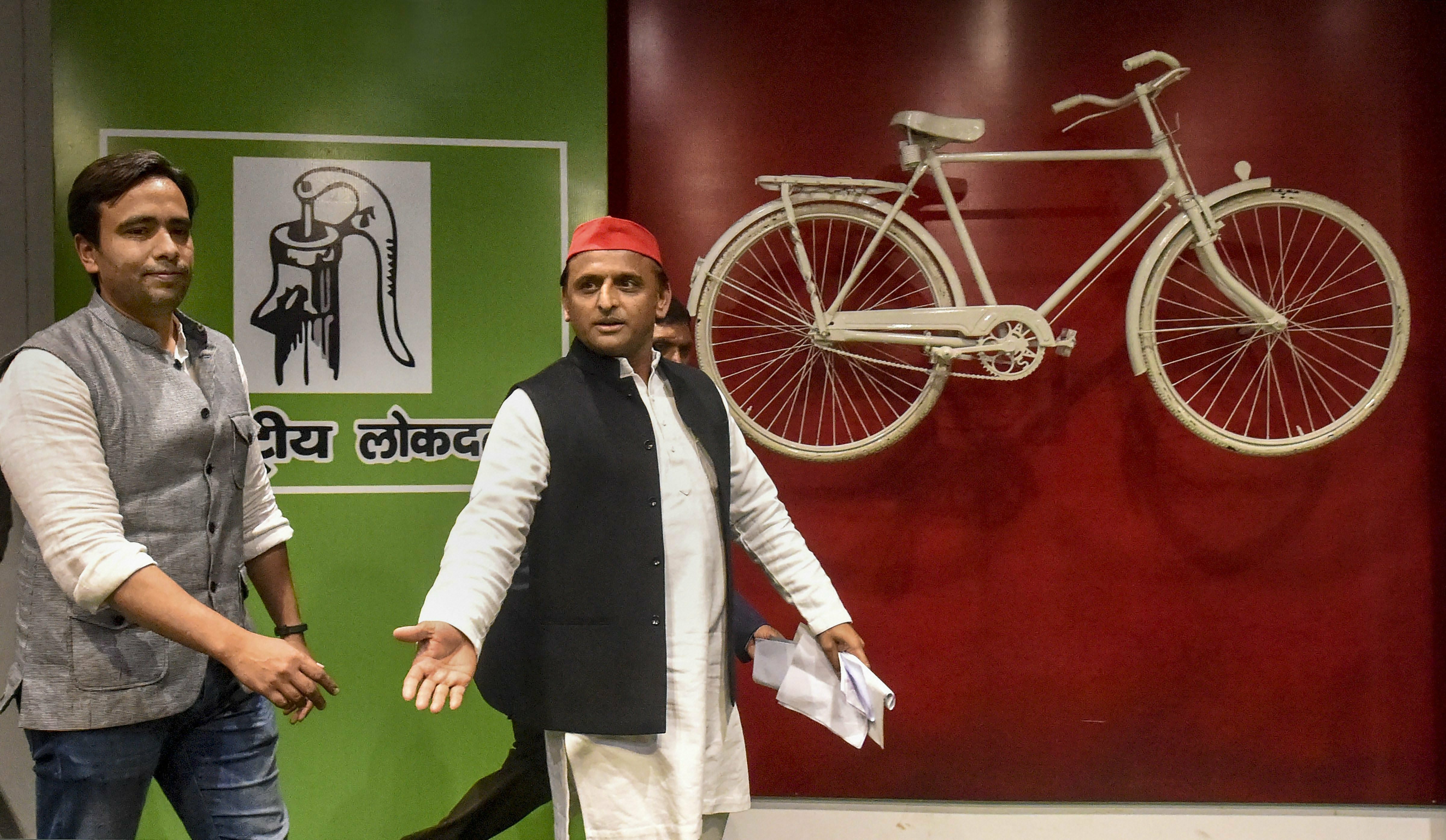 Samajwadi Party (SP) President Akhilesh Yadav and RLD Vice President Jayant Chaudhary arrive for a joint press conference, at the SP office - PTI