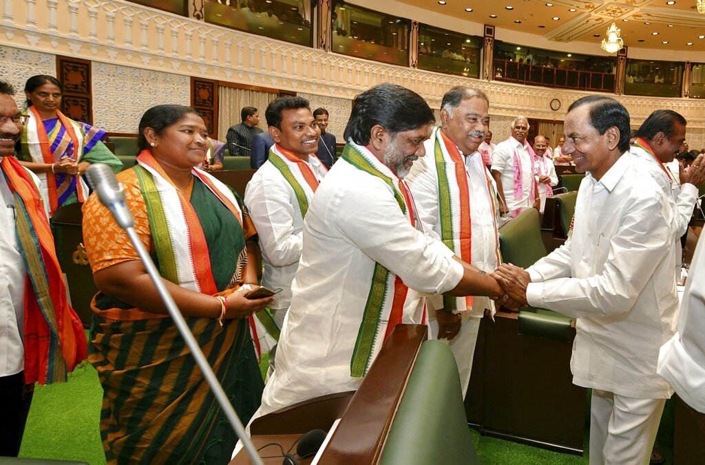 Telangana Chief Minister K Chandrasekhar Rao meets Congress MLAs at start of the first session of state Assembly, in Hyderabad - PTI
