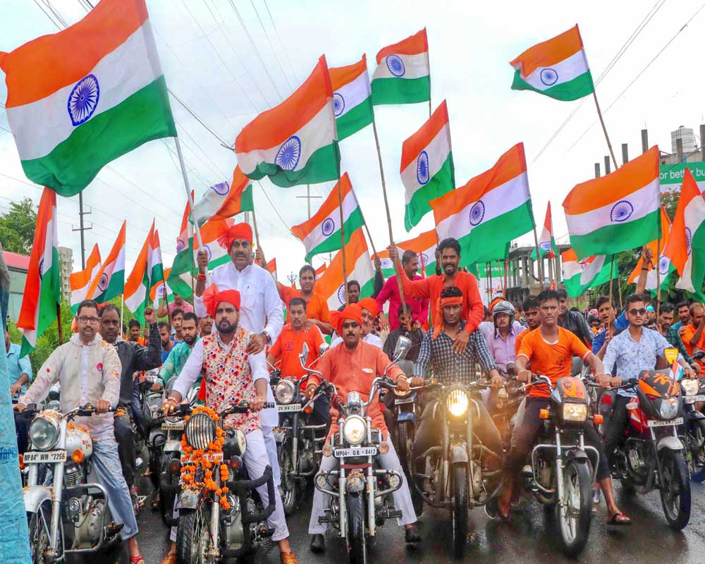 BJP MLA Rameshwar Sharma along with his supporters hold Tricolour as they take part in 'Tiranga Yatra' on the eve of 73rd Independence Day, in Bhopal - PTI