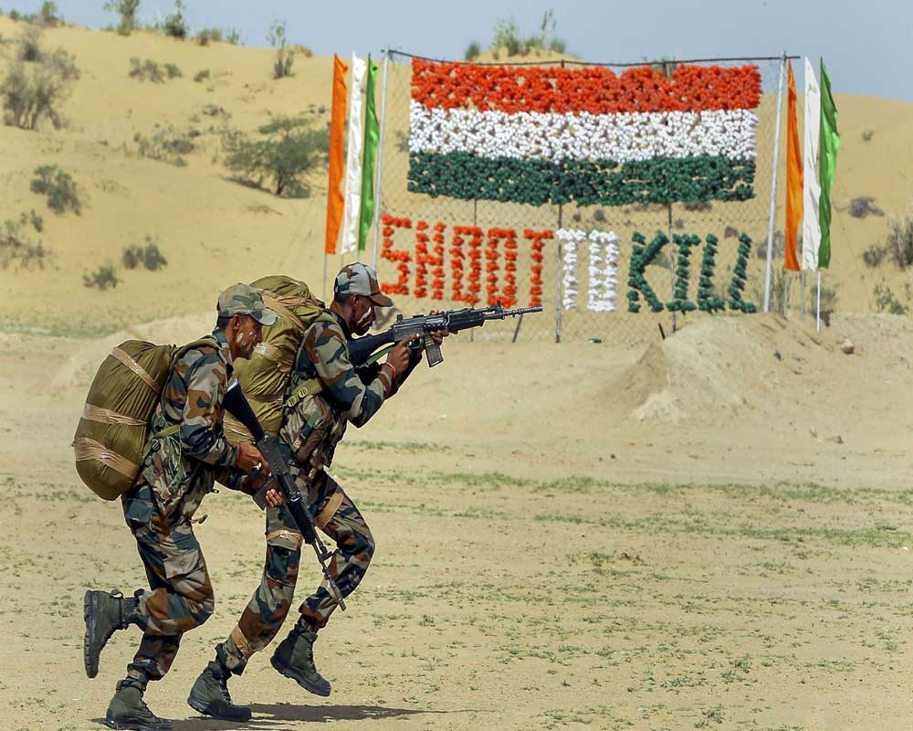 Army soldiers take part in a drill during the Stage 4 of the on-going International Army Scout Masters Competition 2019, at The Scouts Trail in Jaisalmer Military Station - PTI