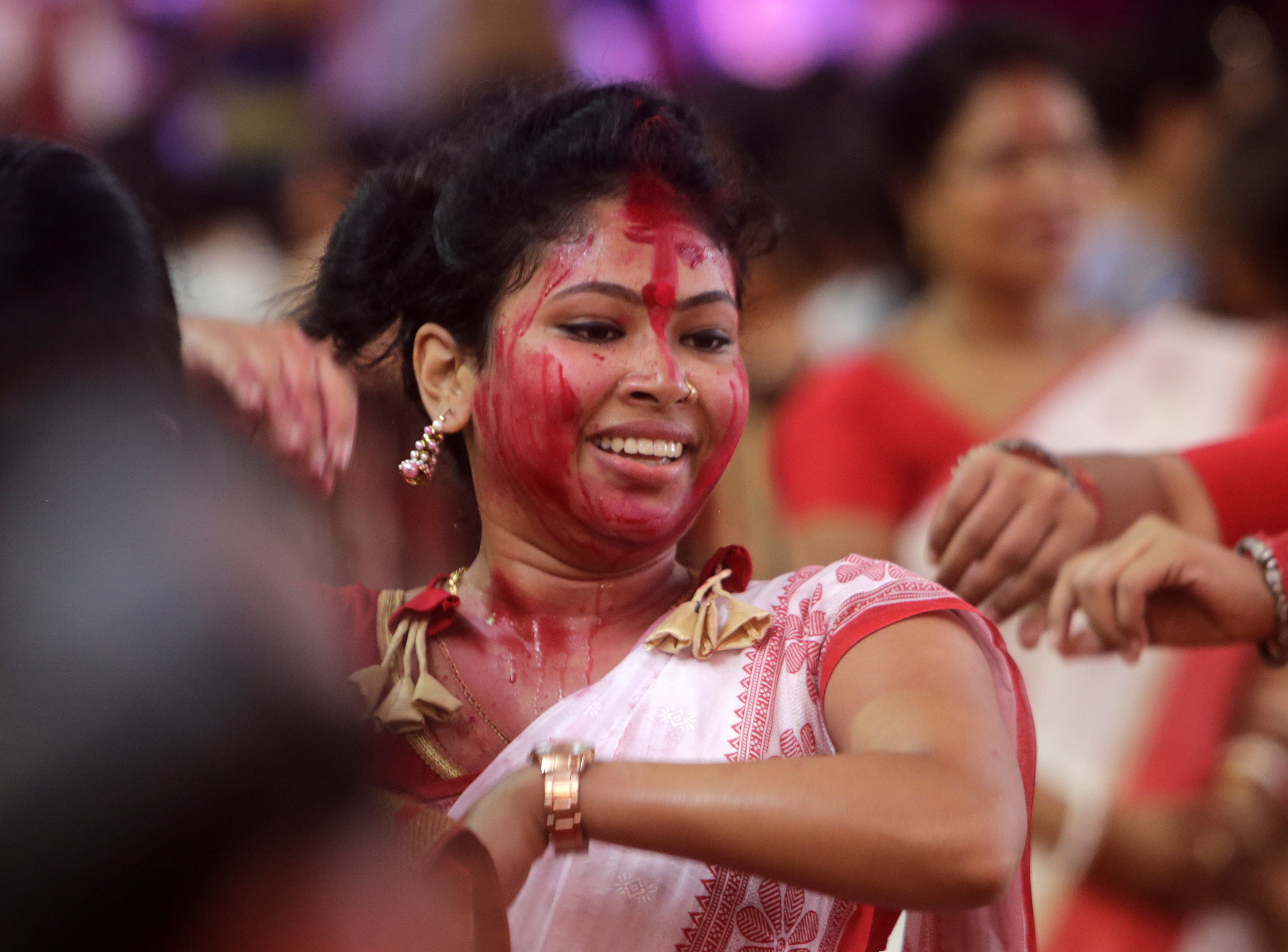 An Indian woman dances during Vijayadashmi celebrations in Mumbai, India - AP