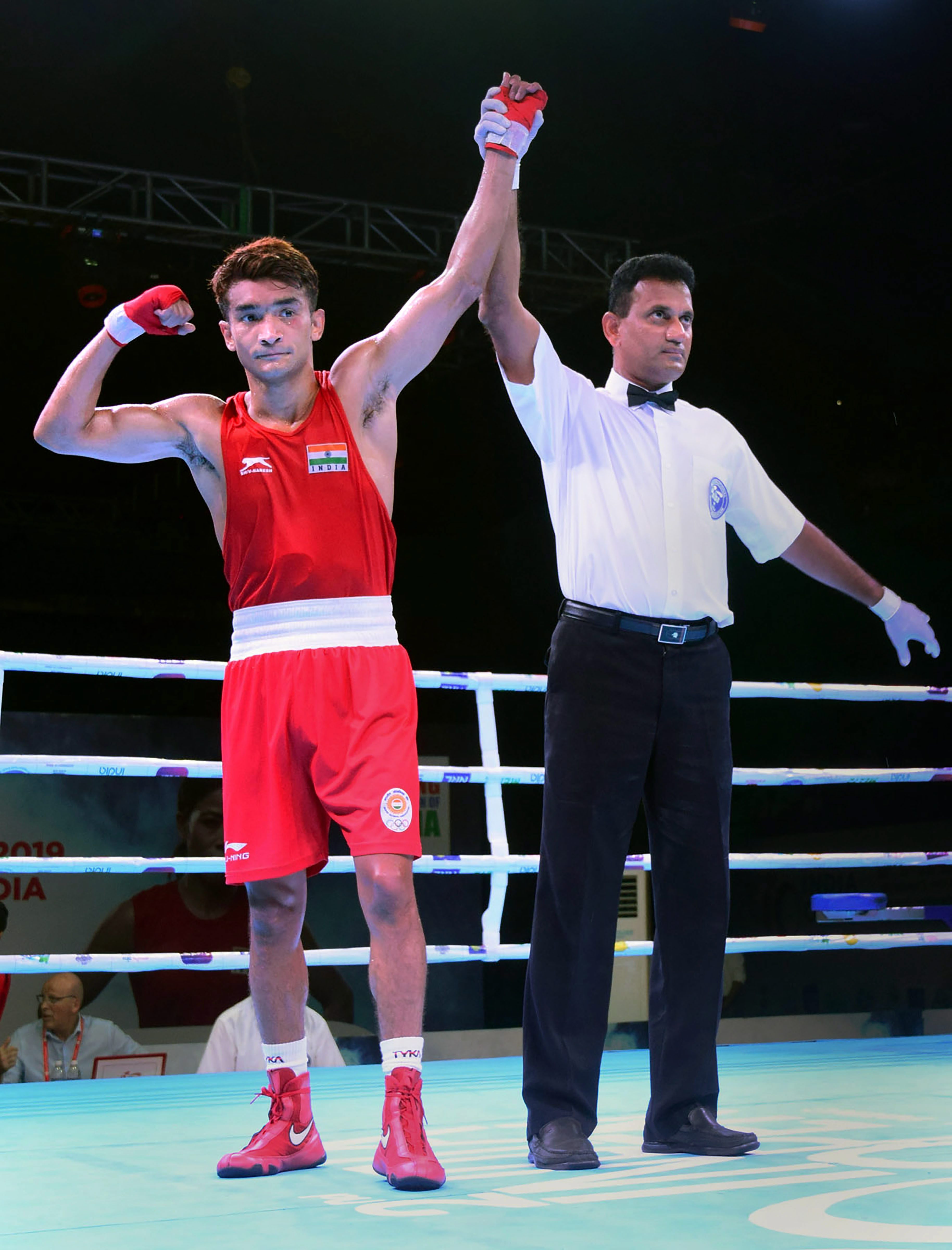 Indian boxer Shiva Thapa being declared winner against Mauritius Hellene Damien in the second edition of Indian Open International Boxing Tournament 2019 in Guwahati - PTI