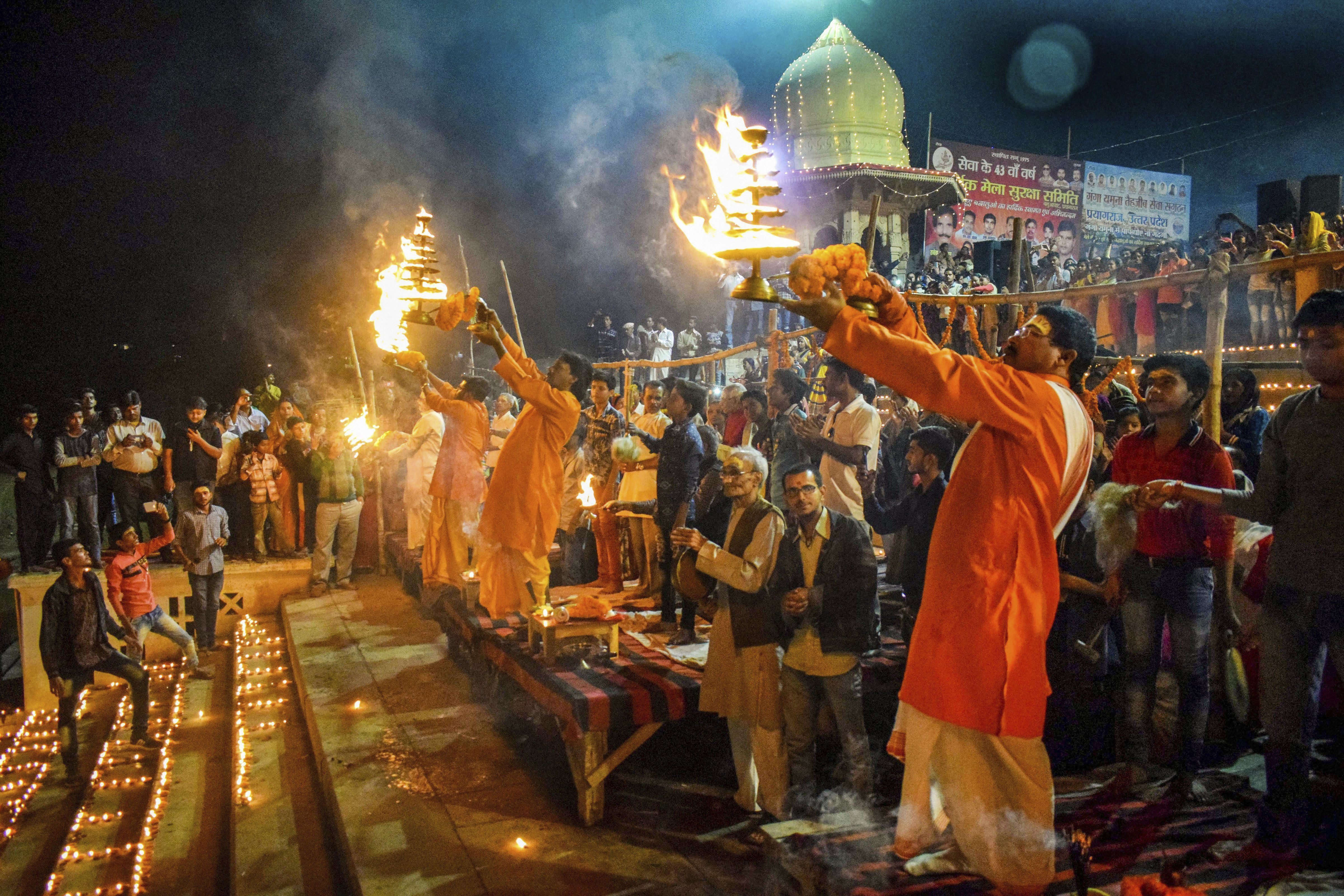 Priests perform 'Maha Aarti' on the occasion of 'Devotthan Ekadashi' festival, in Allahabad - PTI