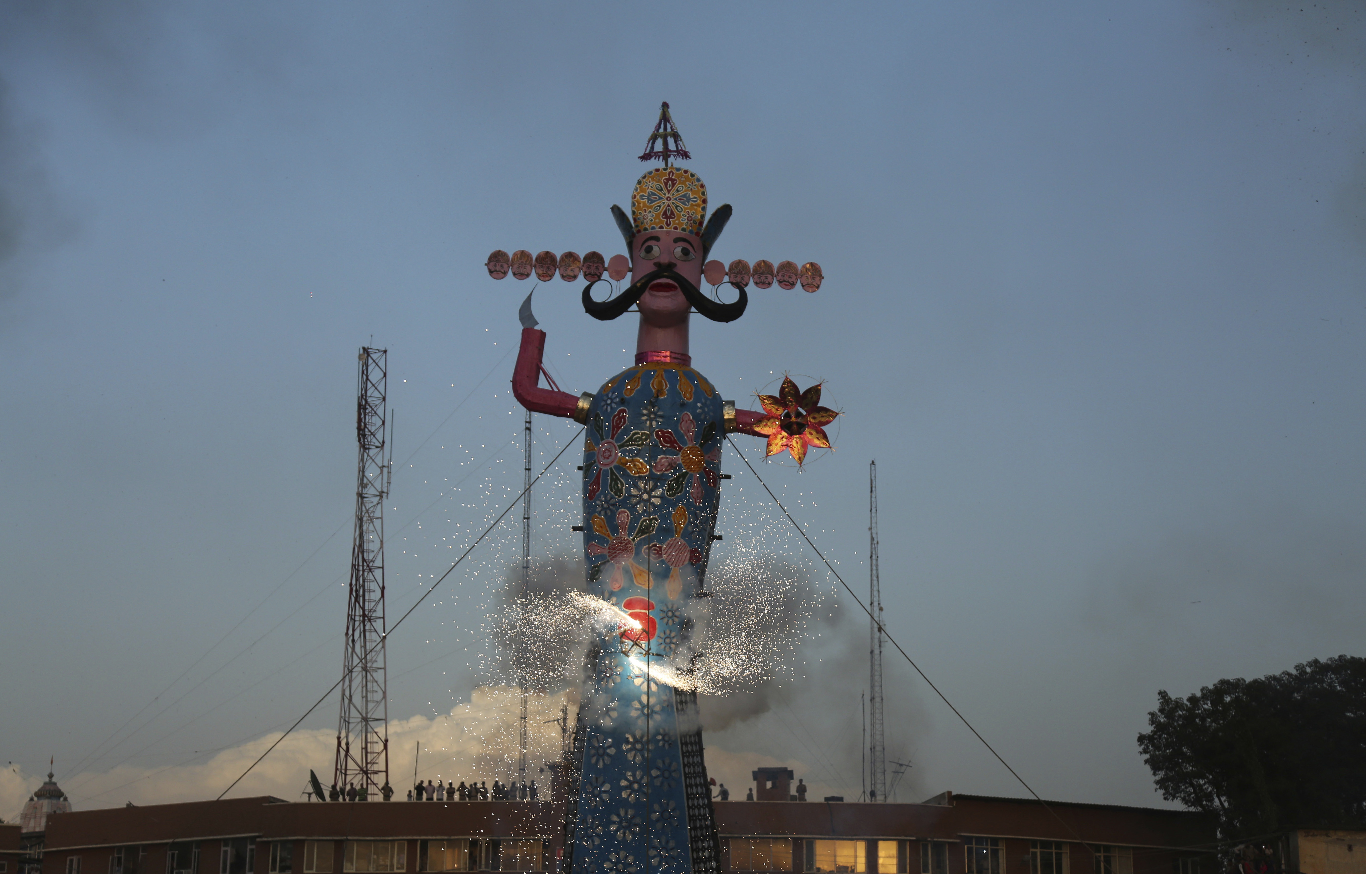 An effigy of demon king Ravana is lit to be burnt marking the end of Dussehra festival in Jammu - AP