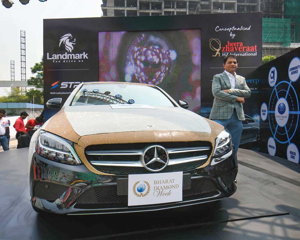 Laxmi Diamond MD Ashok Gajera poses with his Mercedes Benz studded with 3.5 lakh CZ diamonds, worth Rs 10 crore, at the opening of the third edition of Bharat Diamond Week in Mumbai - PTI