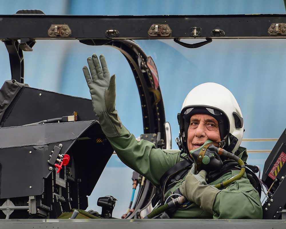 Defence Minister Rajnath Singh prepares to fly in the Tejas fighter aircraft from the HAL airport in Bengaluru - PTI