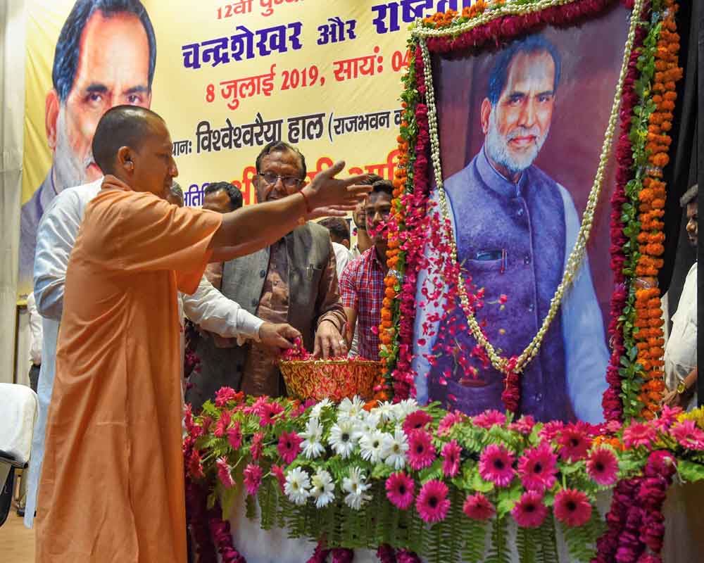 Uttar Pradesh Chief Minister Yogi Aditiyanath pays tributes to former prime minister Chandra Shekhar on his 12th death anniversary, in Lucknow - PTI