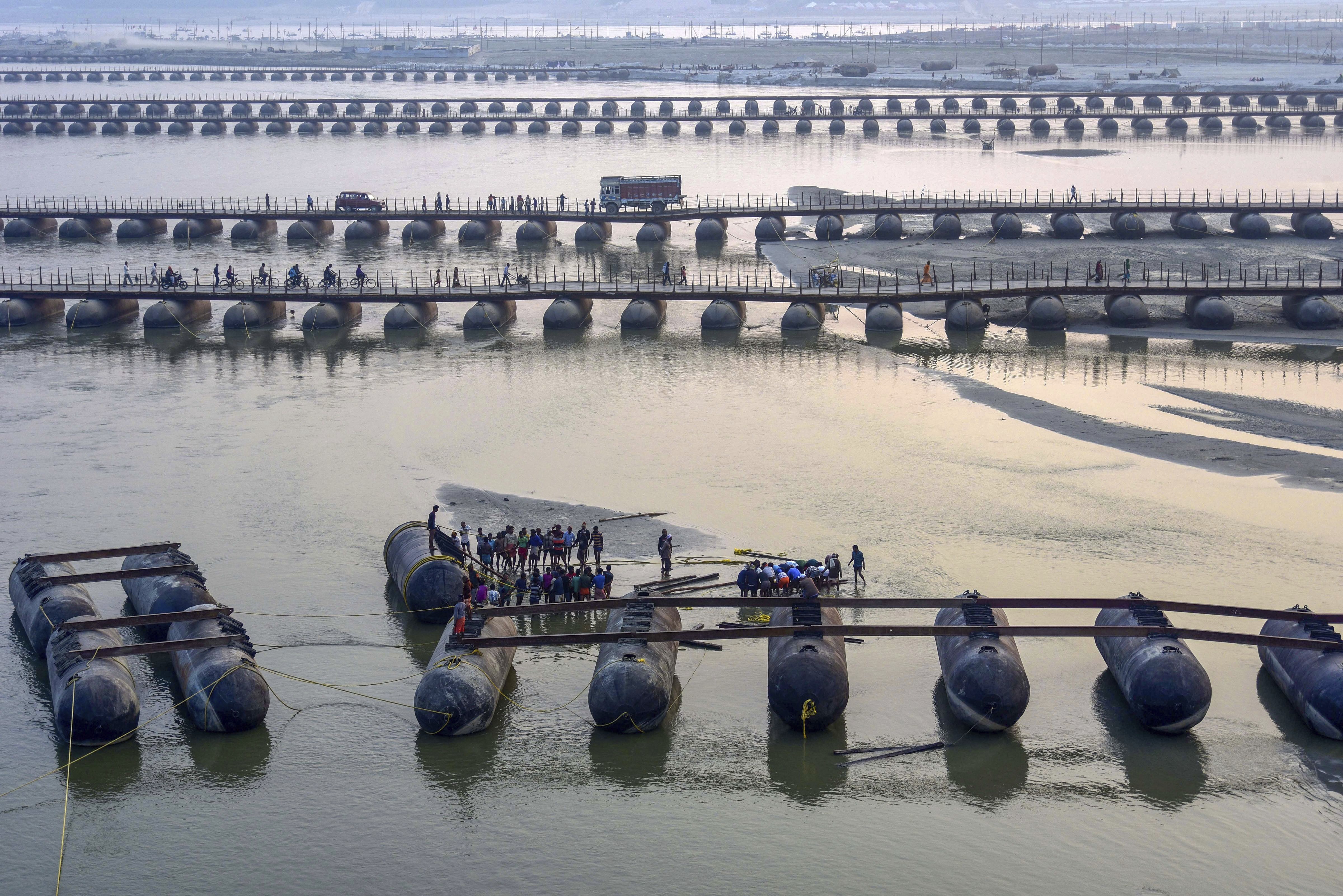 Labourers work for the construction of a pontoon bridge, ahead of Kumbh Mela 2019 on river Ganga, in Allahabad - PTI