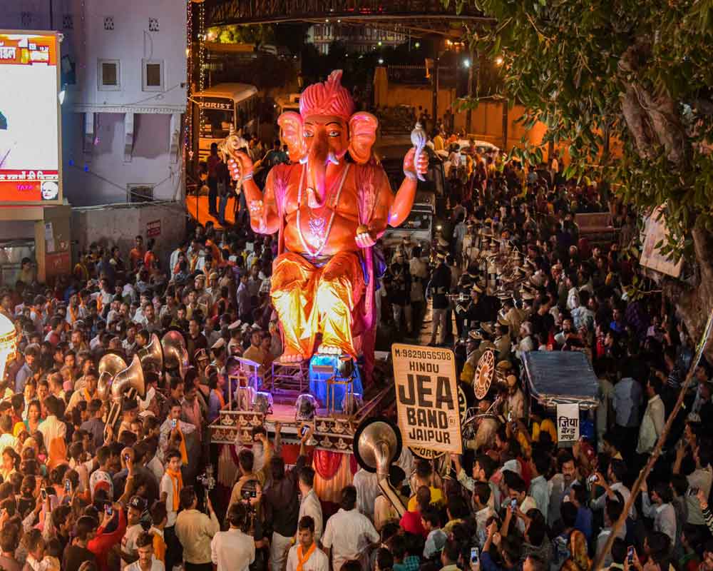 Devotees participate in a procession on the occasion of Ganesh Chaturthi festival, in Jaipur -  PTI