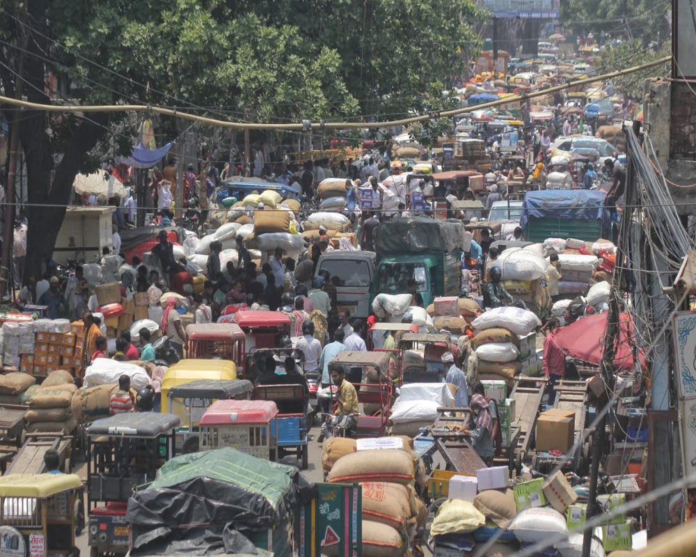 Huge crowd at Khari Baoli market after the reopen of lockdown in New Delhi on Monday 07 June, 2021. - IANS