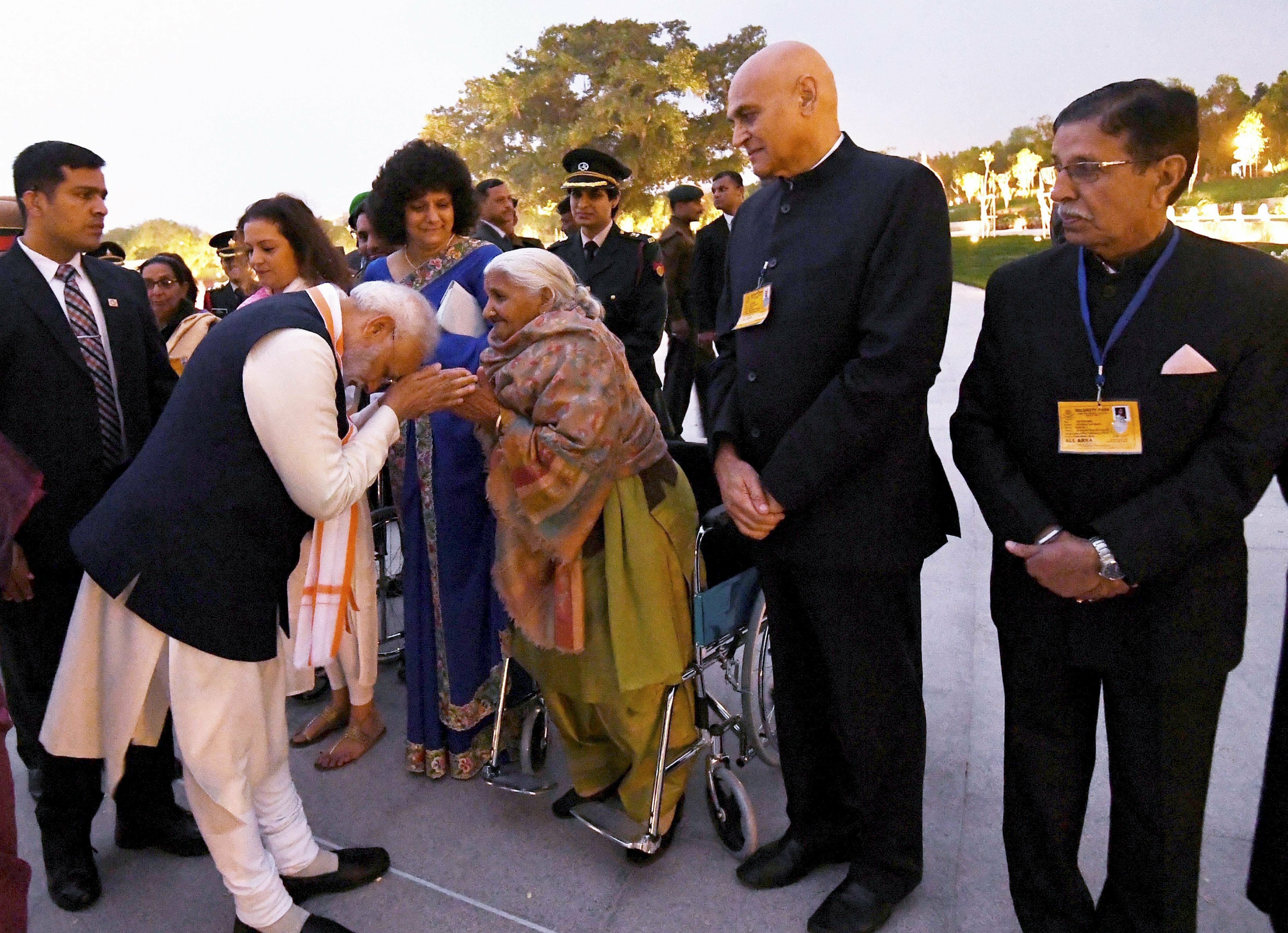 Prime Minister Narendra Modi interacts with the families of ex-servicemen during the dedication ceremony of the National War Memorial (NWM), at India Gate complex in New Delhi
