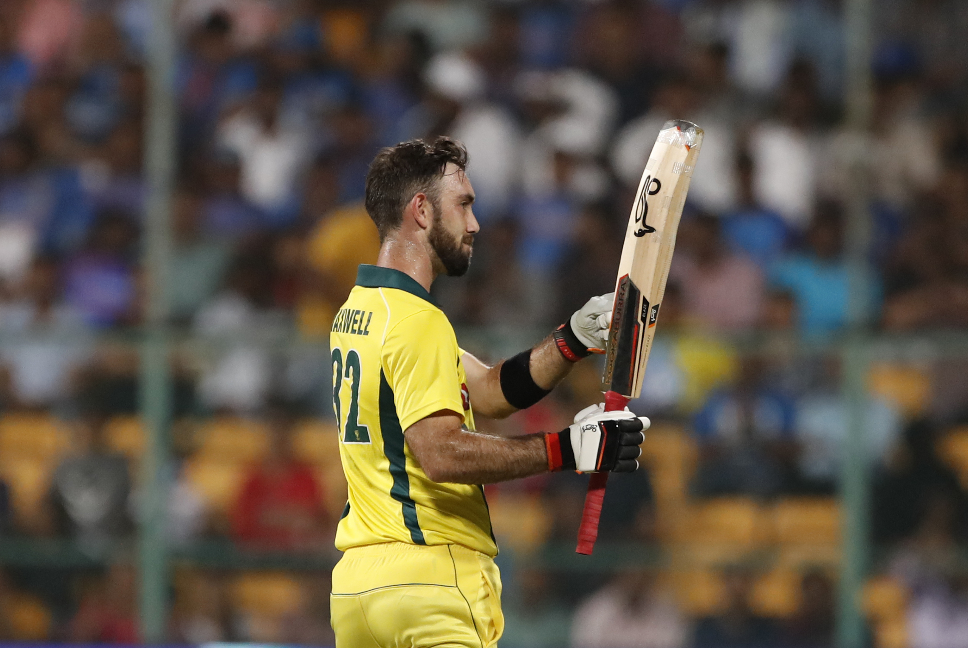 Australia's Glenn Maxwell gestures towards his team dugout after scoring fifty runs during the second T20 international cricket match between India and Australia in Bangalore - AP