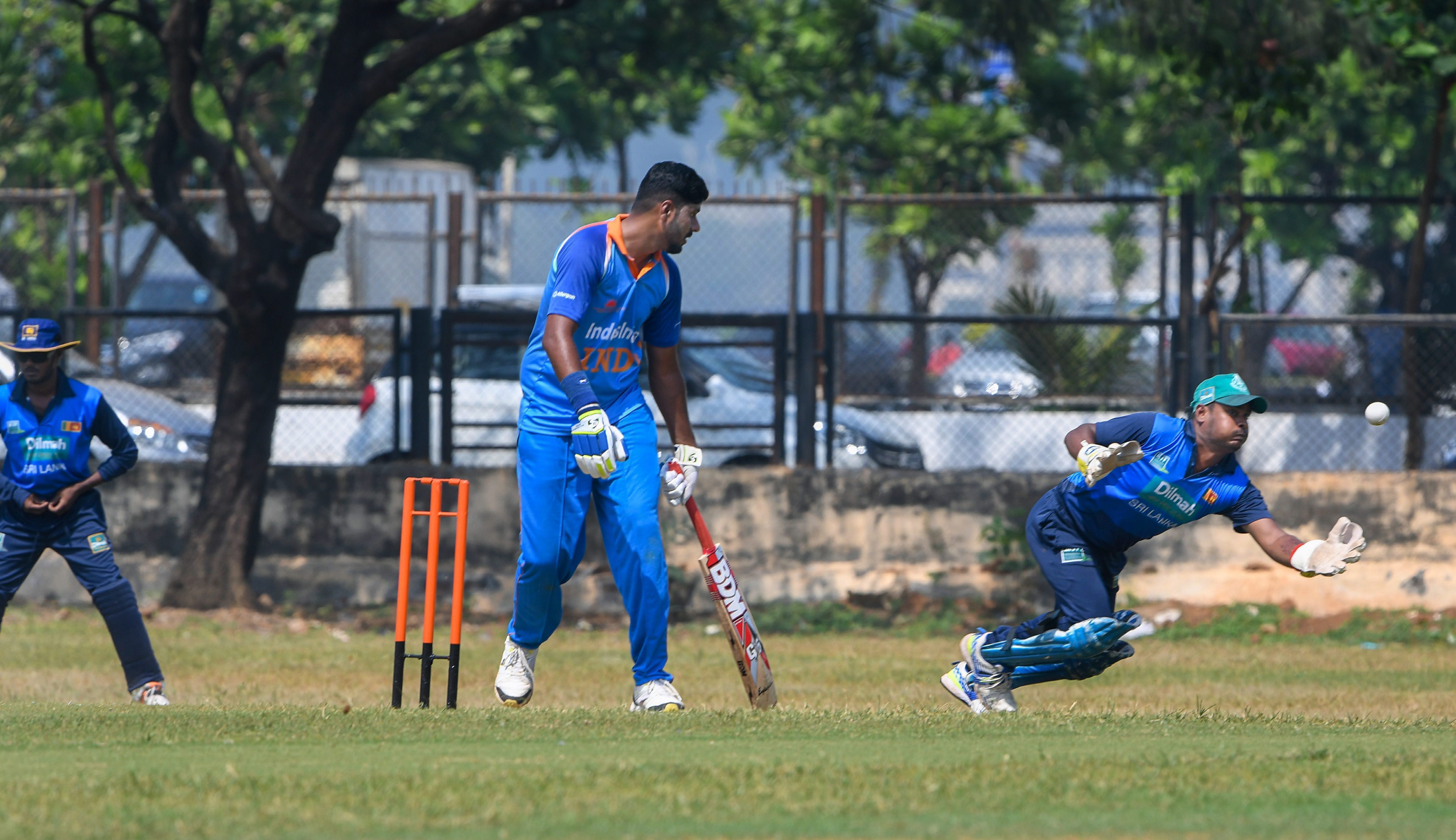 Sri lankan wicket-keeper dives for the ball during India-Sri Lanka International Blind T-20 Cricket match, in Mumbai - PTI