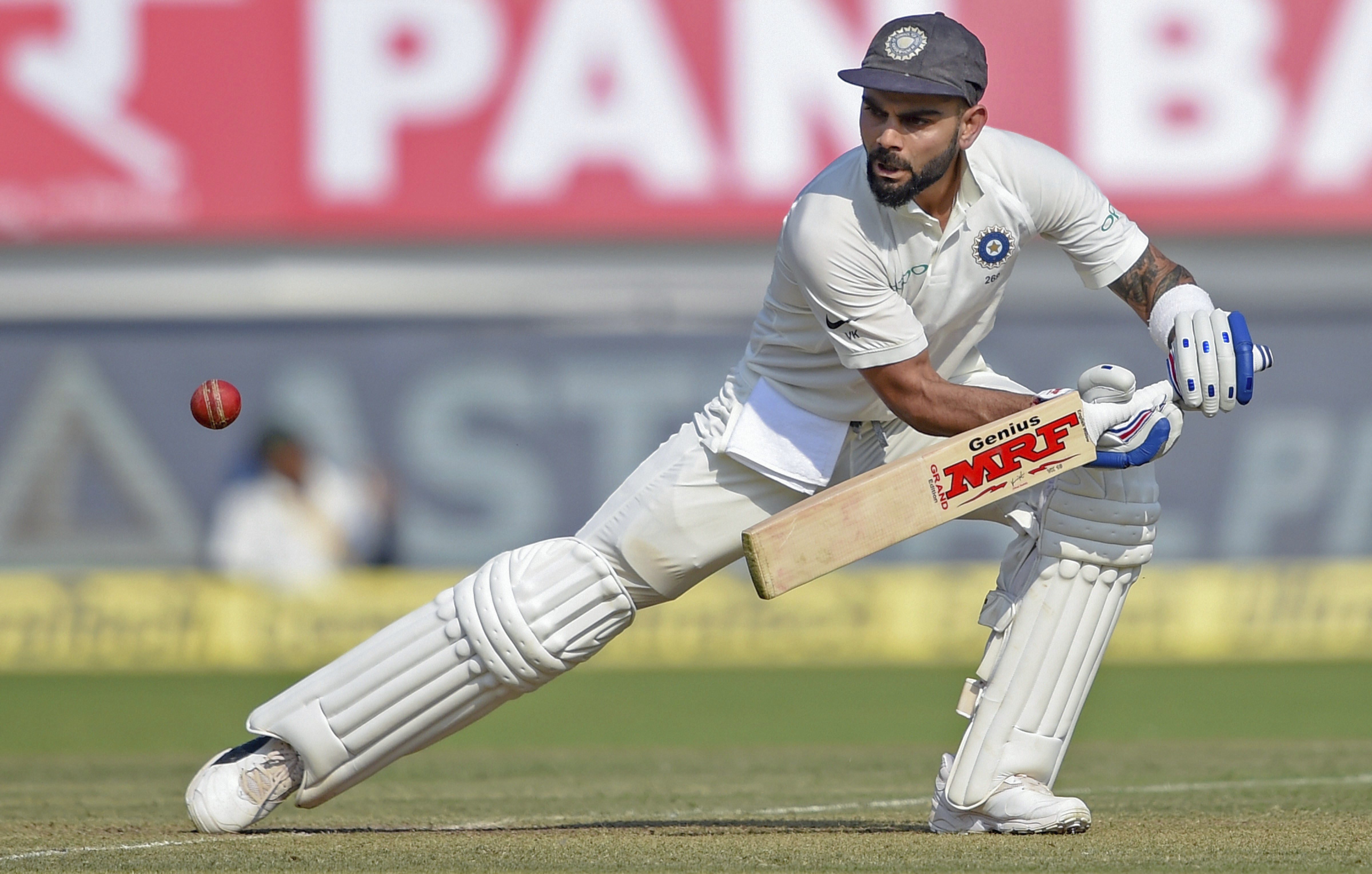 Indian batsman Virat Kohli plays a shot during the first test cricket match played between India and West Indies, in Rajkot - PTI