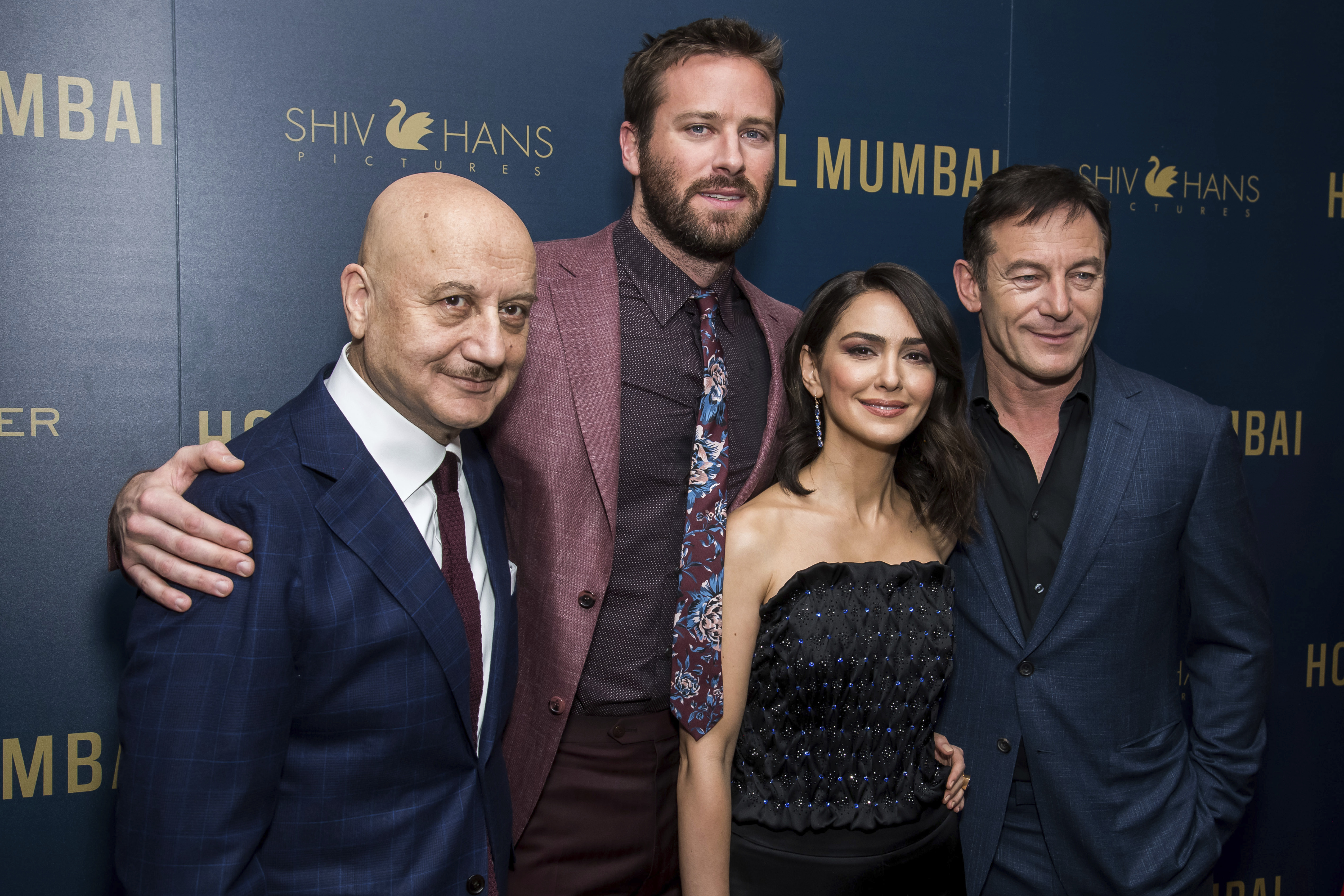 Anupam Kher, left, Armie Hammer, Nazanin Boniadi and Jason Isaacs attend a screening of 