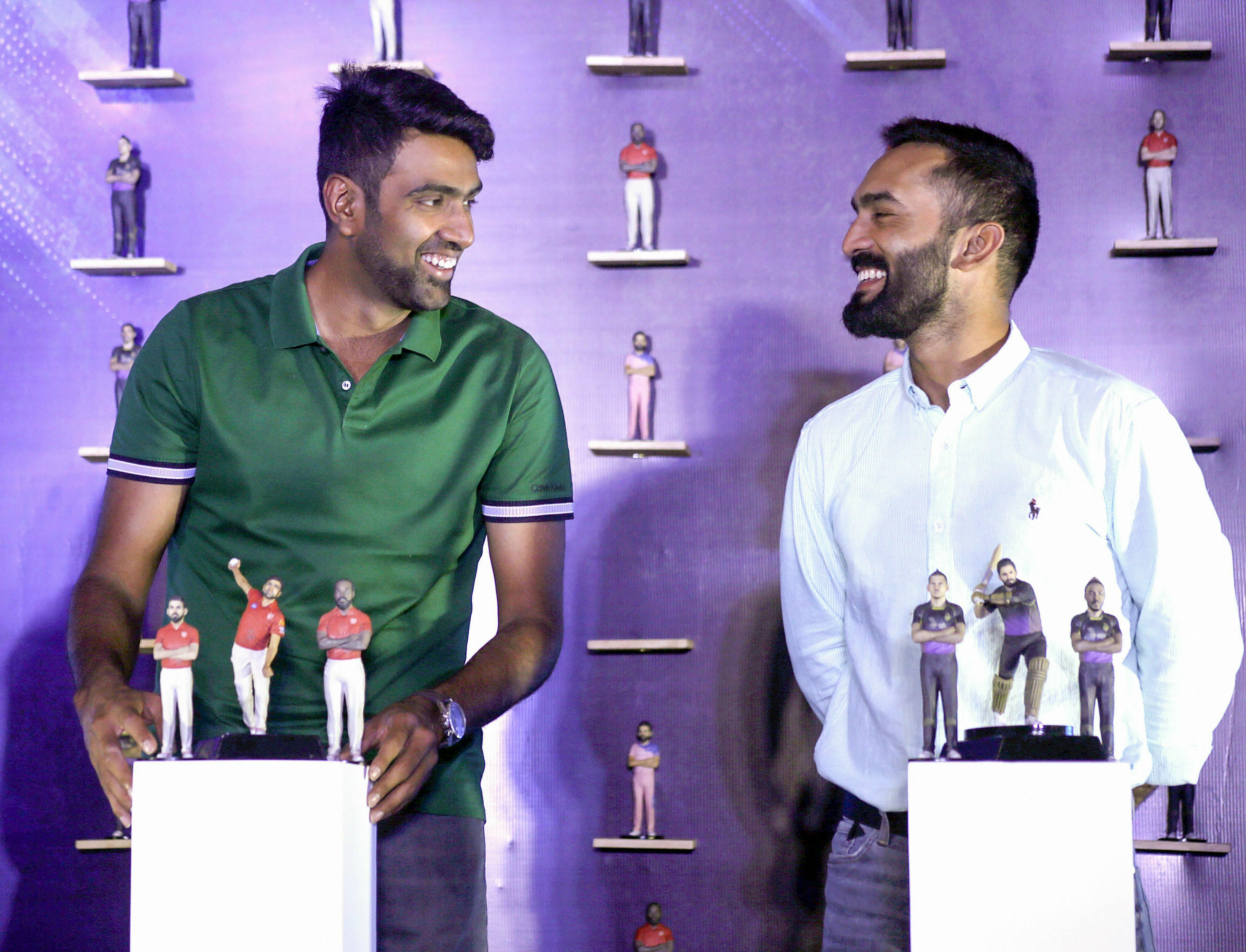Kings XI Punjab's R Ashwin with Kolkata Knight Riders' Dinesh Karthik at the launch of CricFig official licensed figurine, in Mumbai - PTI