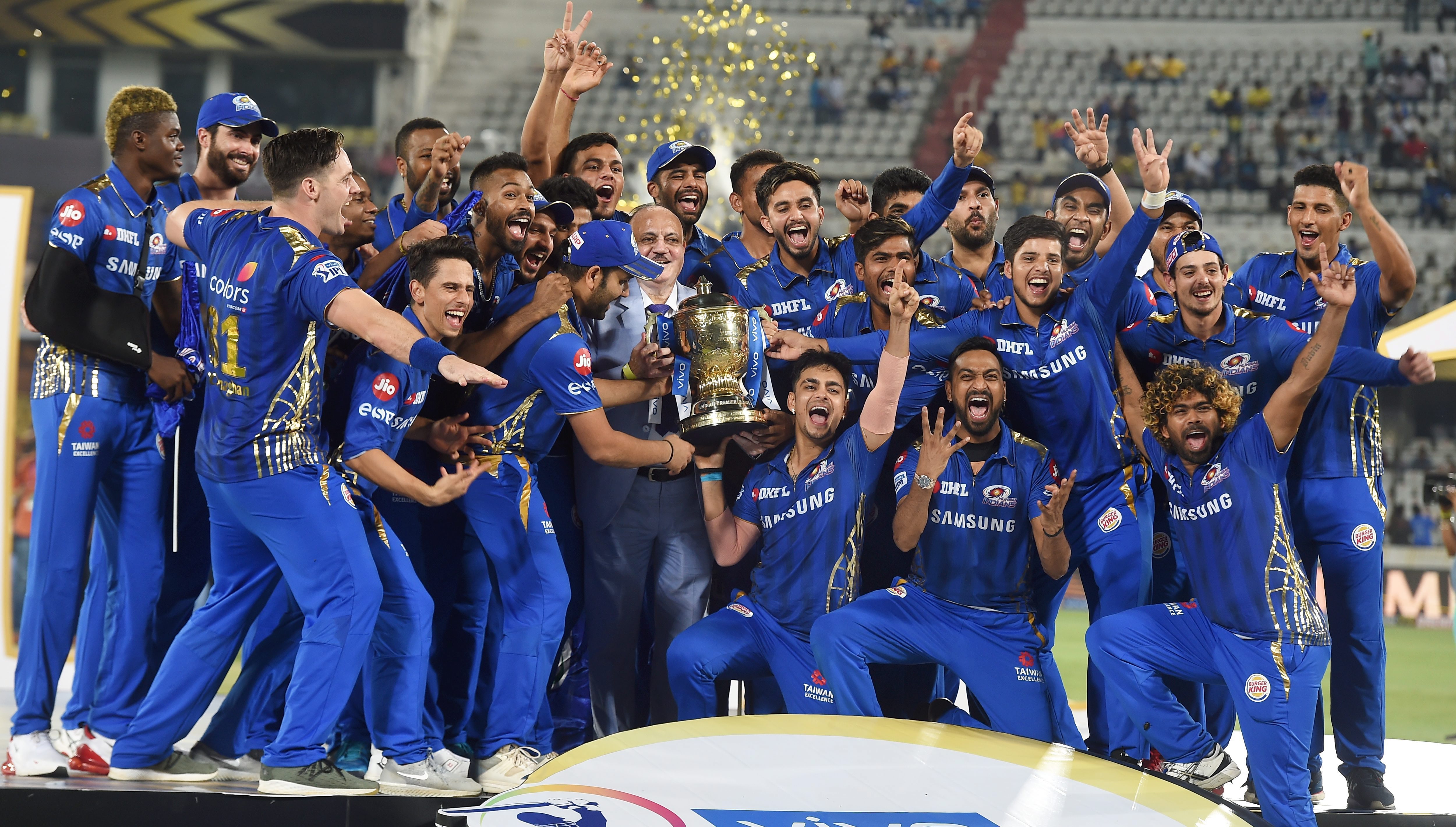 Mumbai Indians (MI) players celebrate with the  IPL 2019 trophy after winning the final match against Chennai Super Kings.- PTI