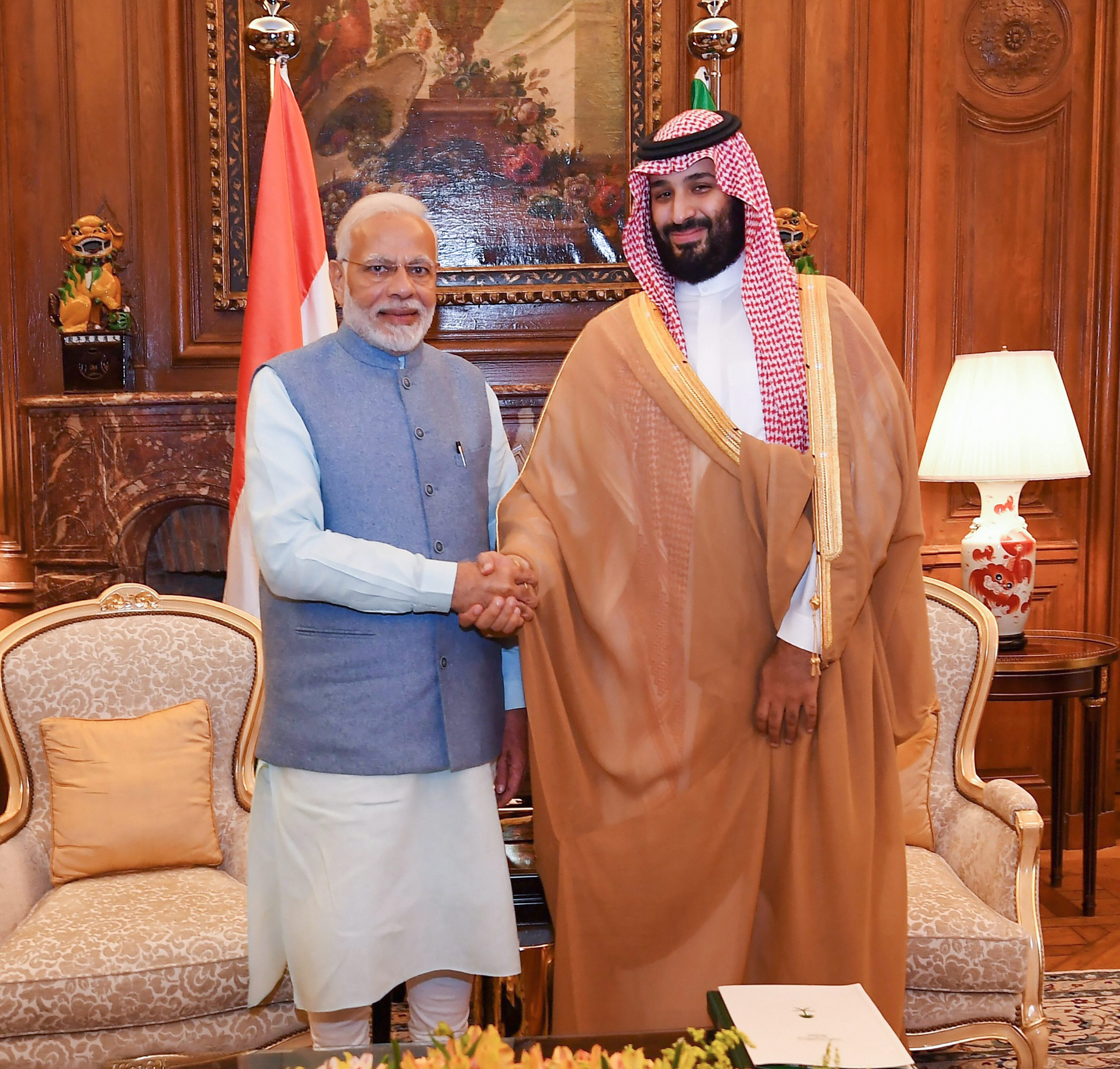 Prime Minister Narendra Modi shakes hands with Saudi Crown Prince Mohammed bin Salman on the sidelines of G20 Summit, in Buenos Aires - PTI