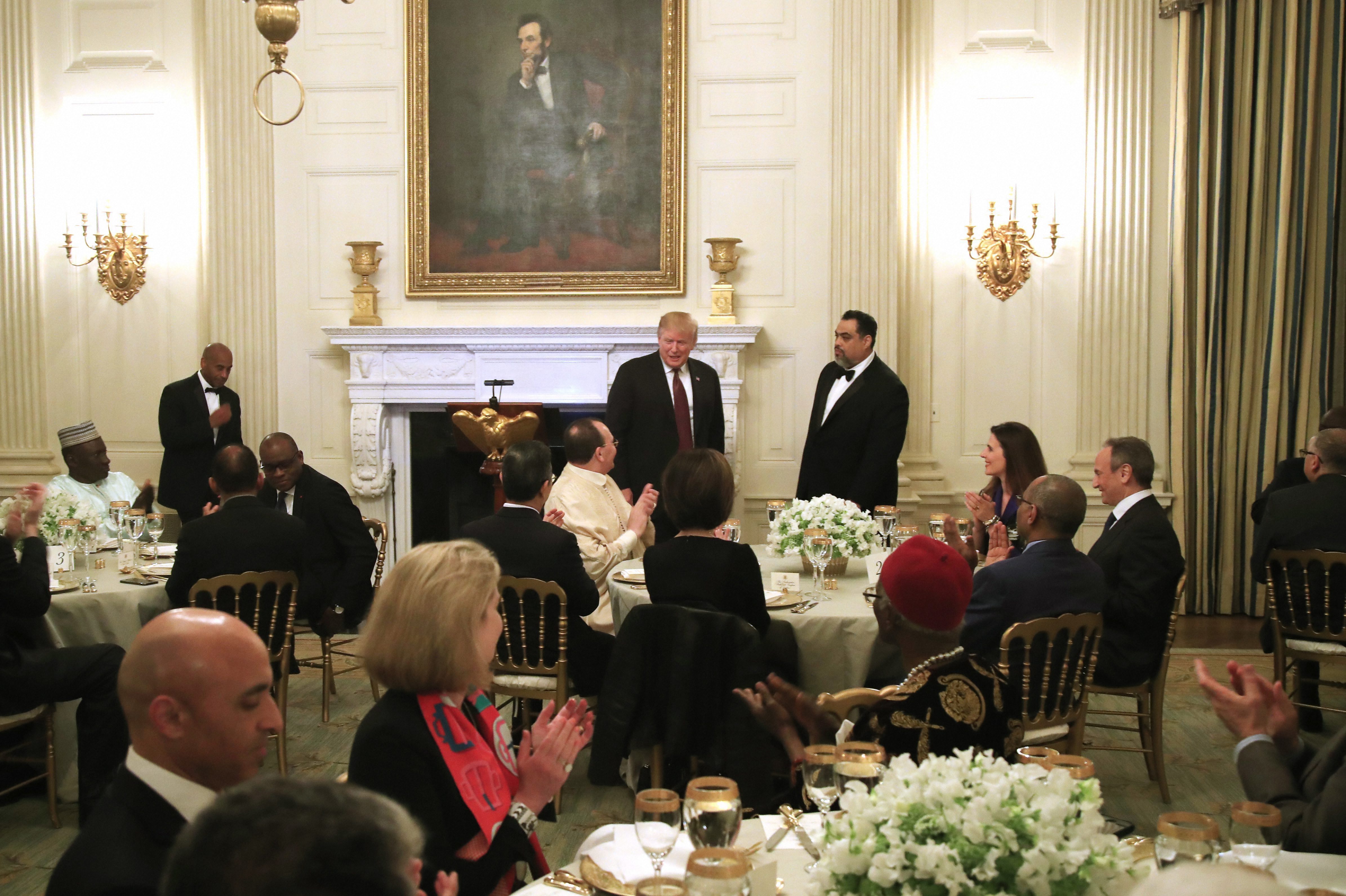 President Donald Trump joins an iftar dinner, which breaks a daylong fast, celebrating Islam's holy month of Ramadan, in the State Dining Room of the White House in Washington - PTI