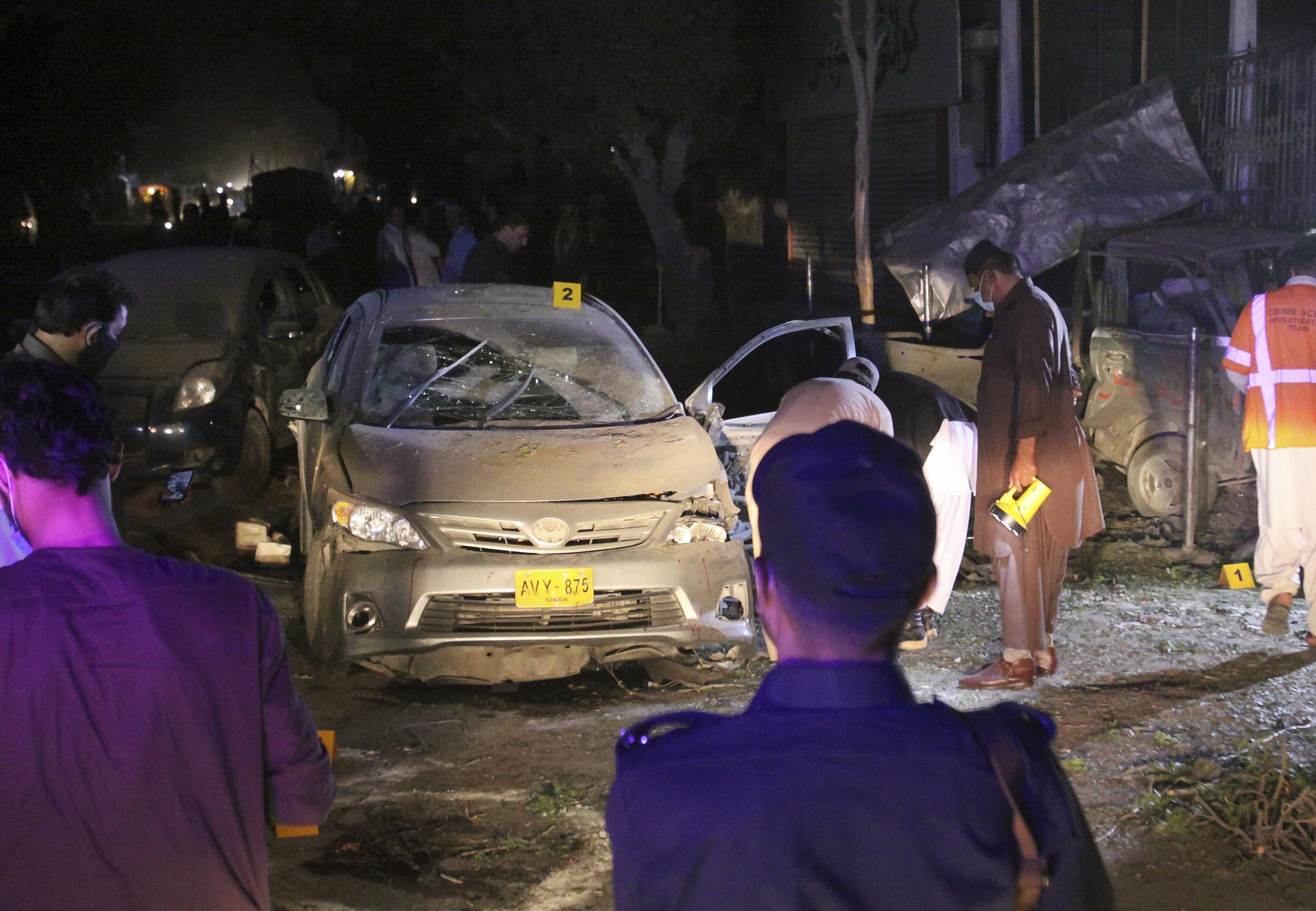 Investigators examine the site of bombing in Quetta, Pakistan - PTI