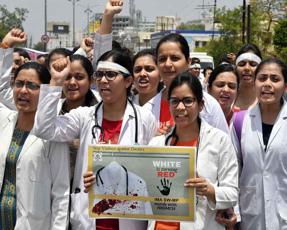 Doctors protest to condemn the attack on some of their colleagues in West Bengal, in Bhopal - PTI