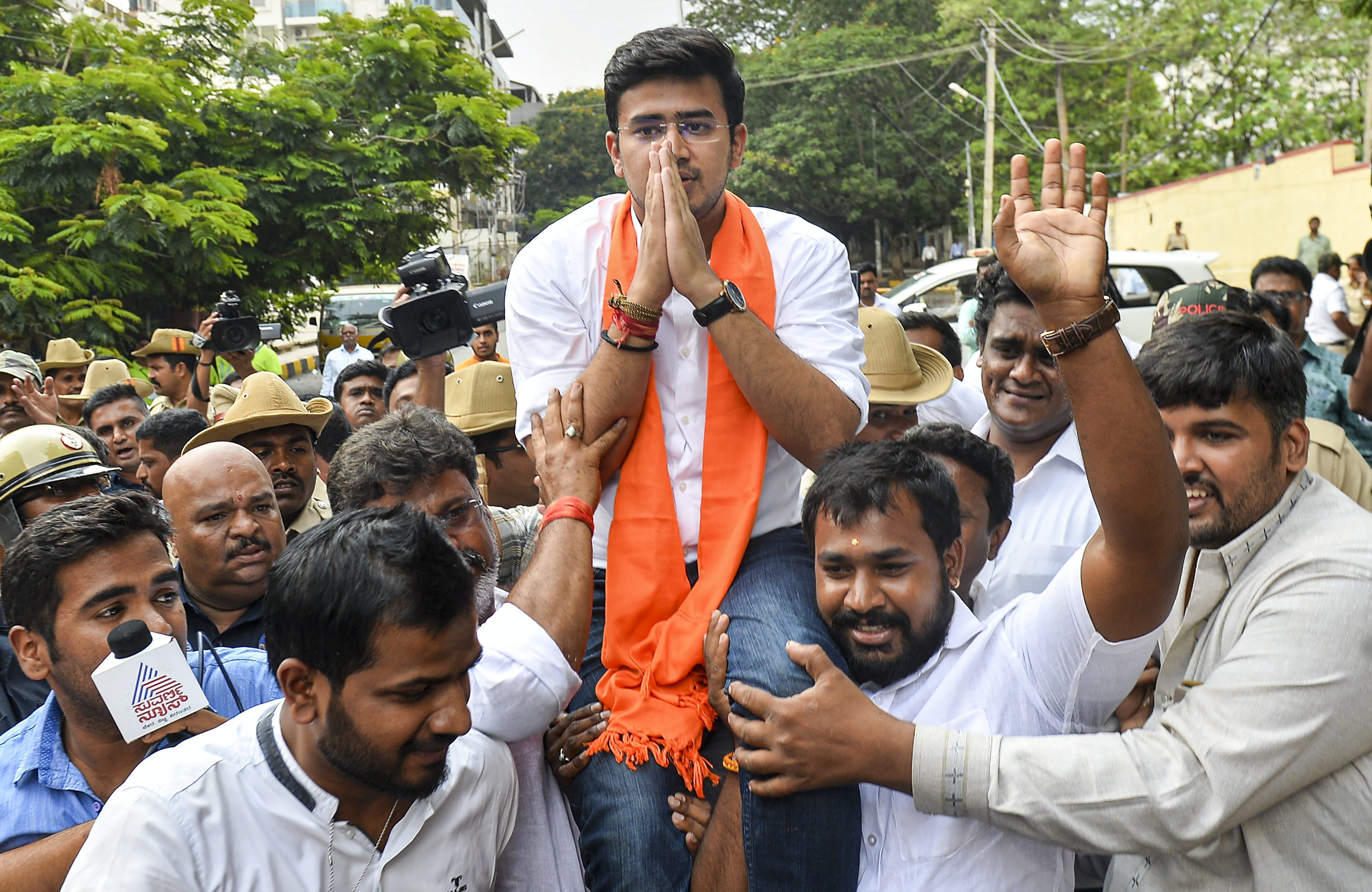 BJP's Bangalore South candidate Tejasvi Surya greets party supporters after his win in the Lok Sabha elections 2019 - PTI