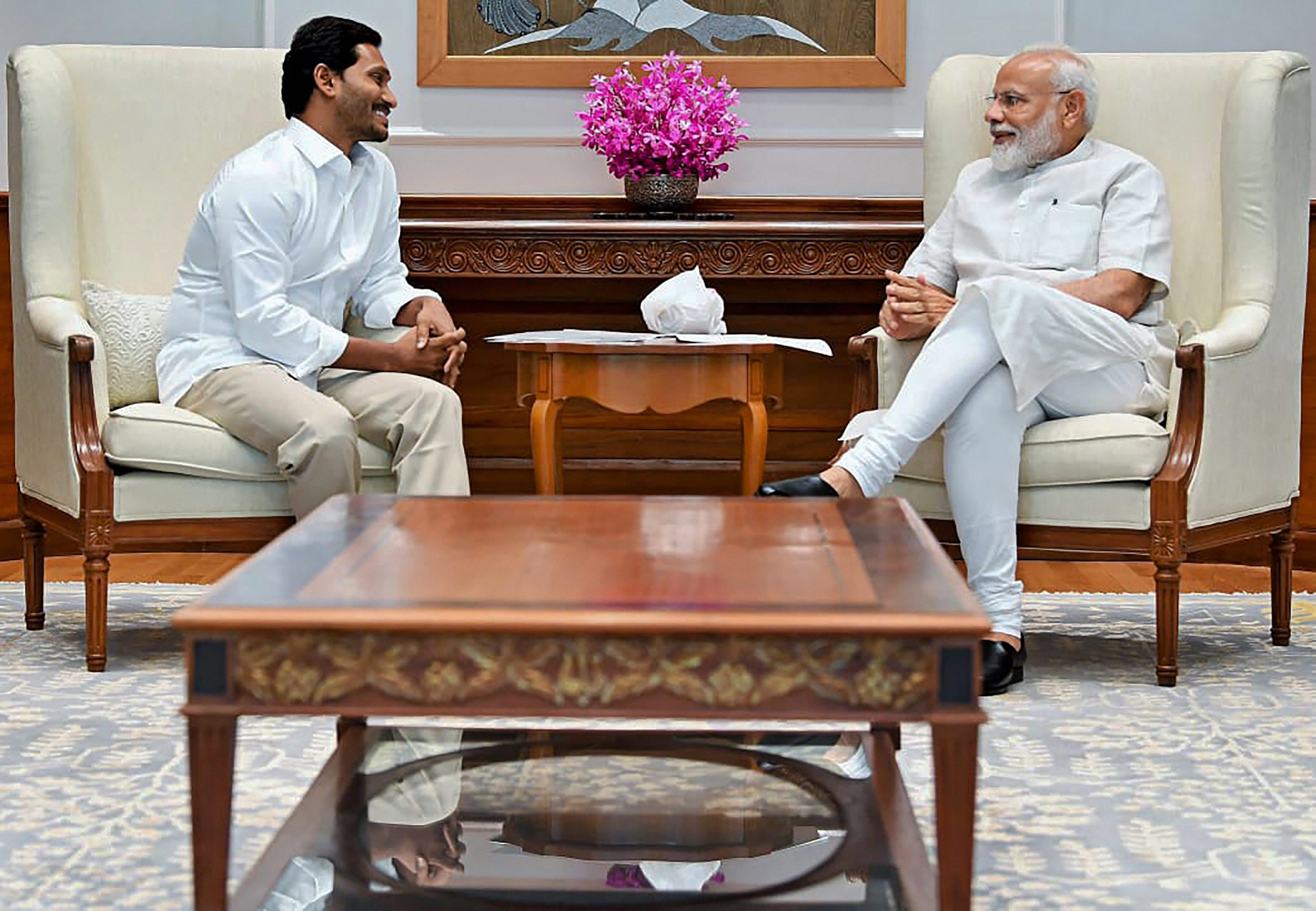 Prime Minister Narendra Modi meets YSR Congress Party President and Andhra Pradesh Chief Minister-designate YS Jagan Mohan Reddy, at his residence  in New Delhi - PTI