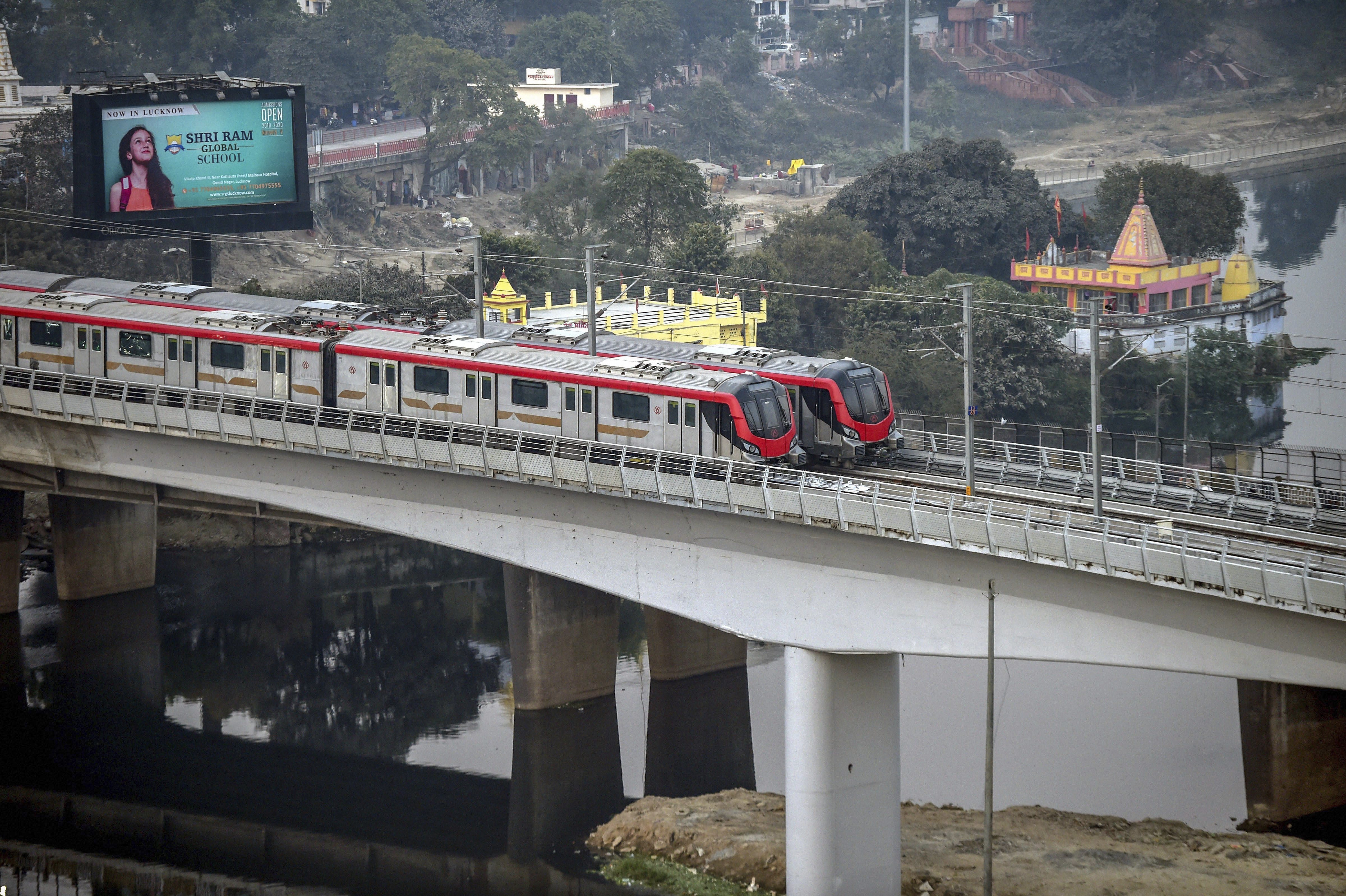 A Lucknow Metro rake during a test run on bridge over river Gomti, in Lucknow - PTI