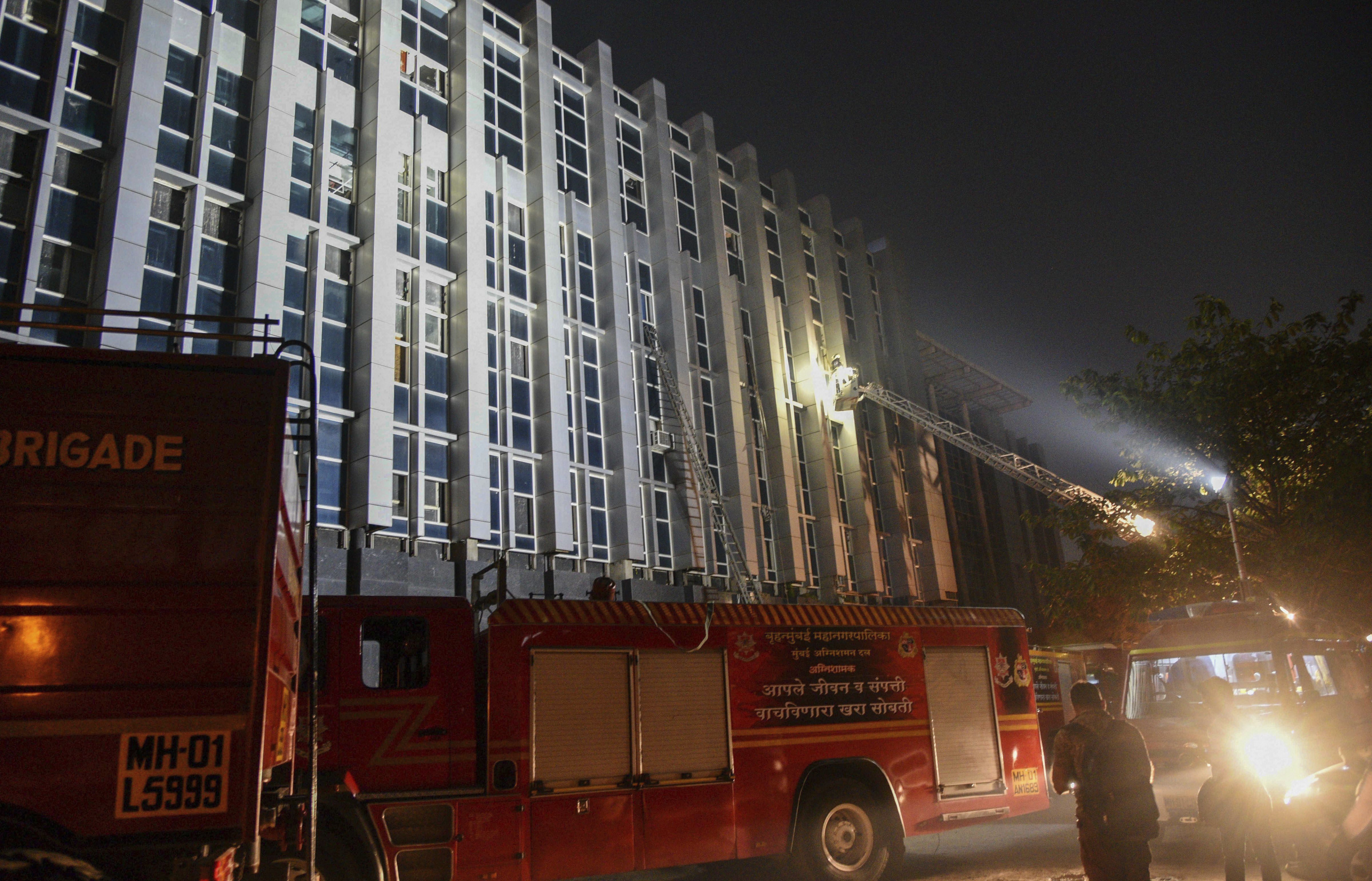 Firefighters conduct rescue after a major fire broke out at ESIC Kamgar Hospital, in Mumbai - PTI