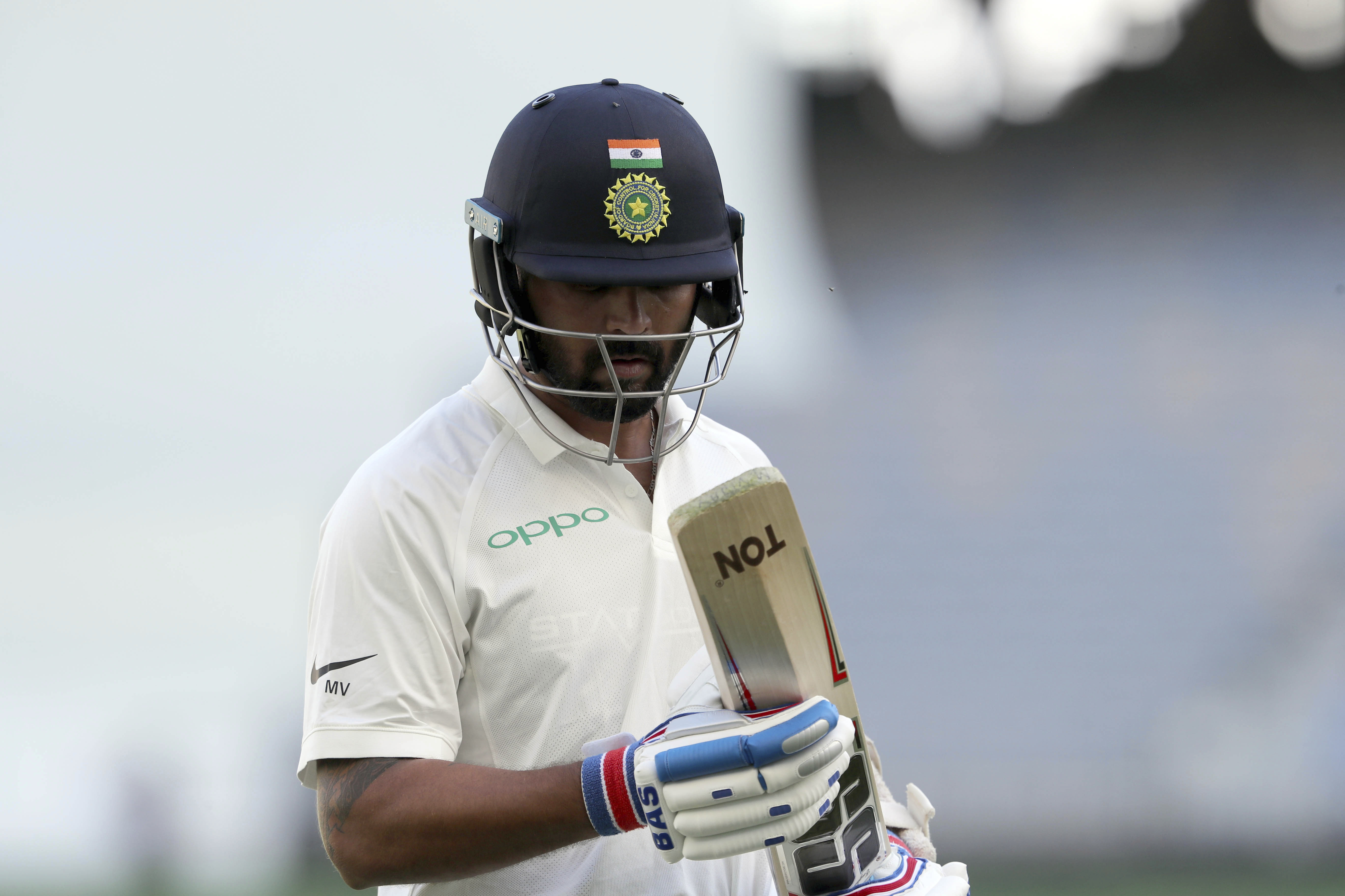 India's Murali Vijay walks off after being dismissed during play in the second cricket test between Australia and India in Perth - AP