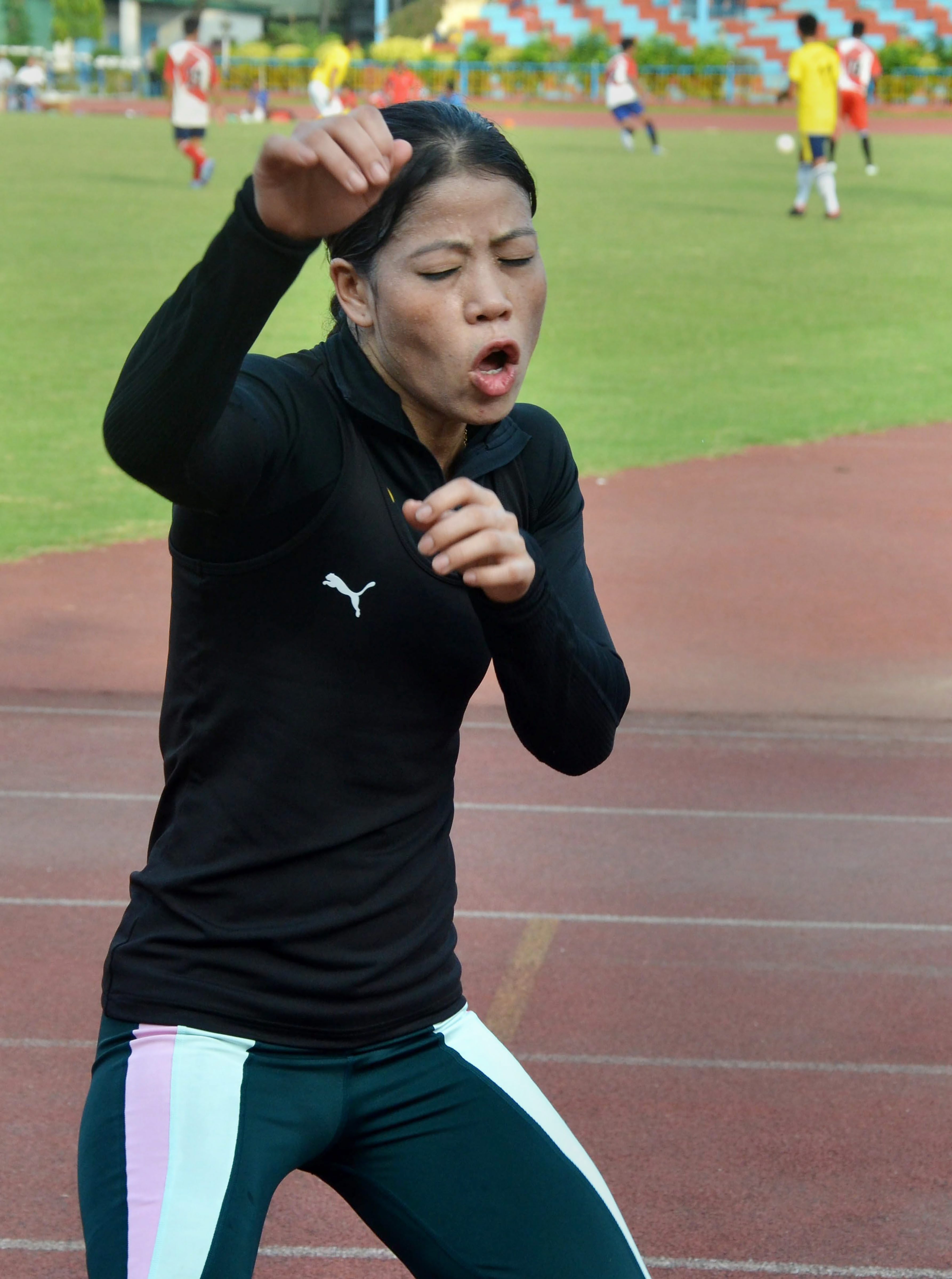 Boxer Mary Kom punches in the air during a training session, in Guwahati - PTI
