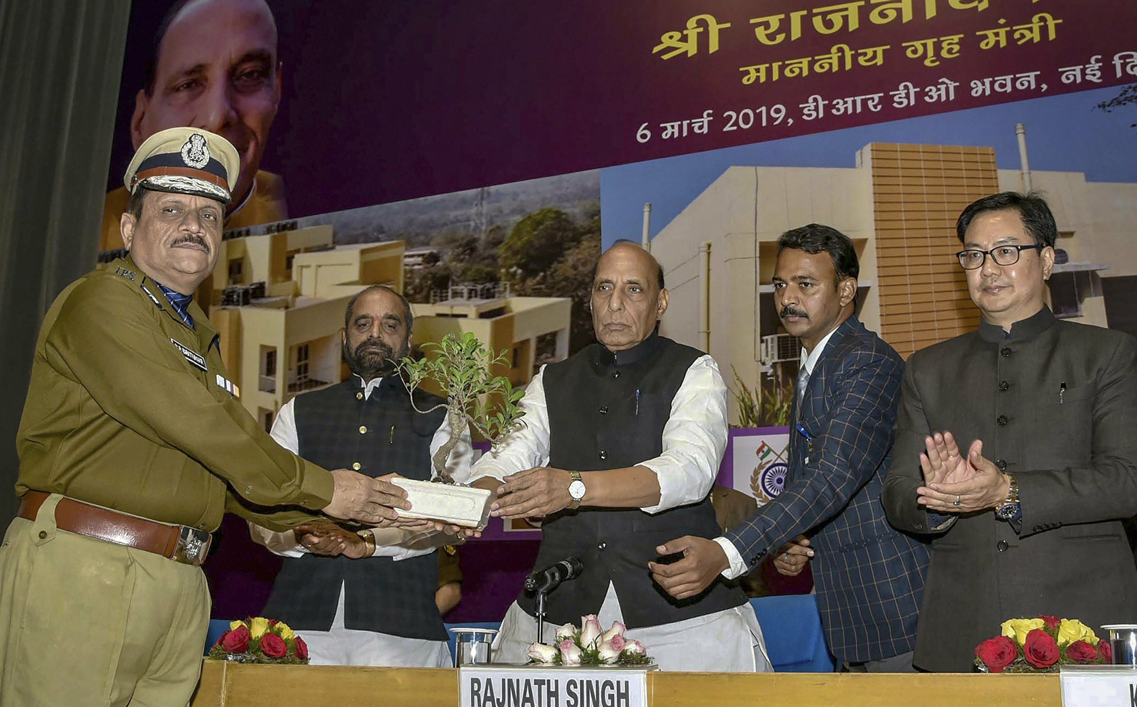 Union Home Minister Rajnath Singh is greeted by Director General of the CRPF, Rajeev Rai Bhatnagar, during the inauguration and foundation stone laying ceremony of various residential and office buildings of CAPFs, CPOs and Delhi Police, in New Delhi - PTI