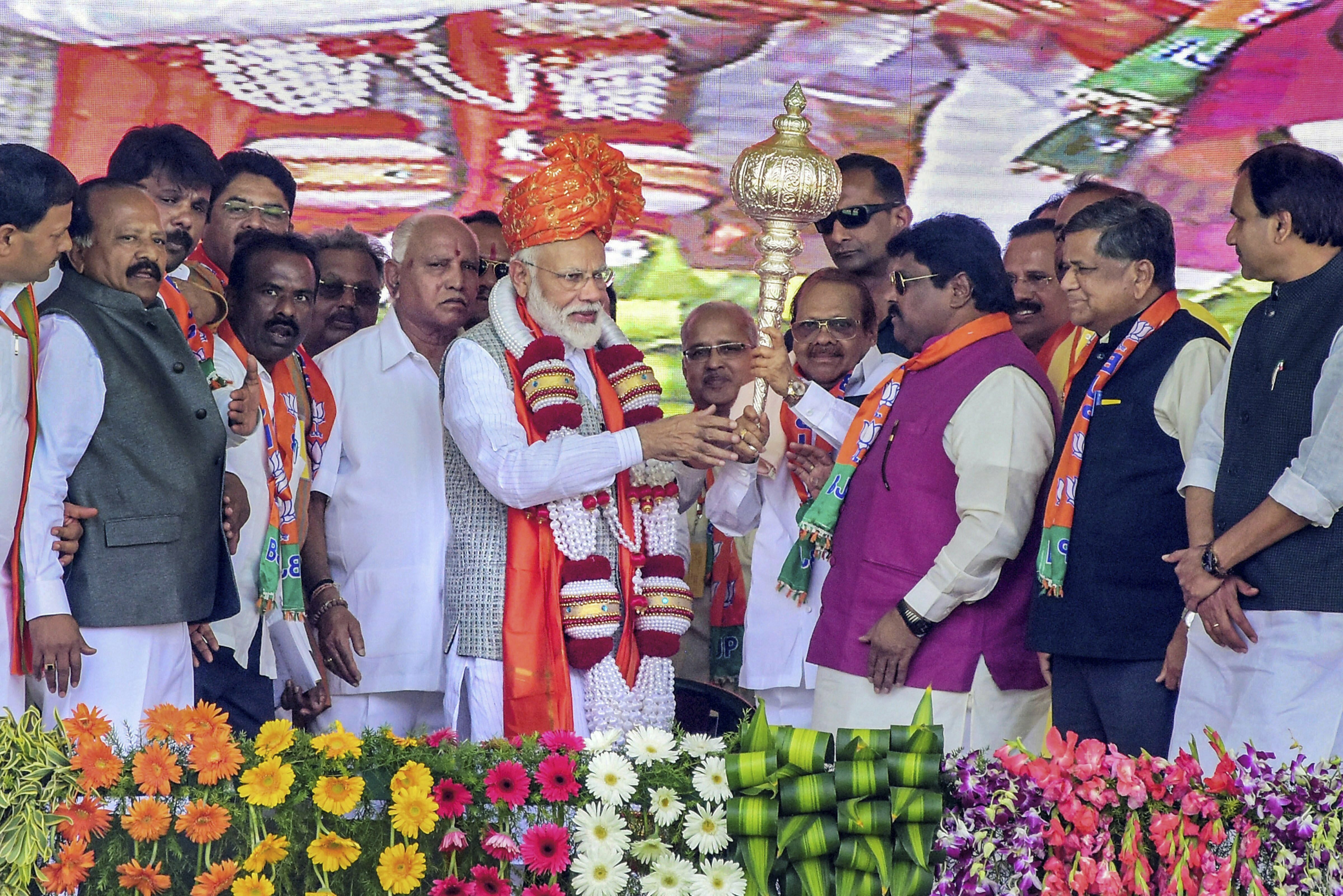 Prime Minister Narendra Modi is felicitated during a rally, in Kalaburagi - AP