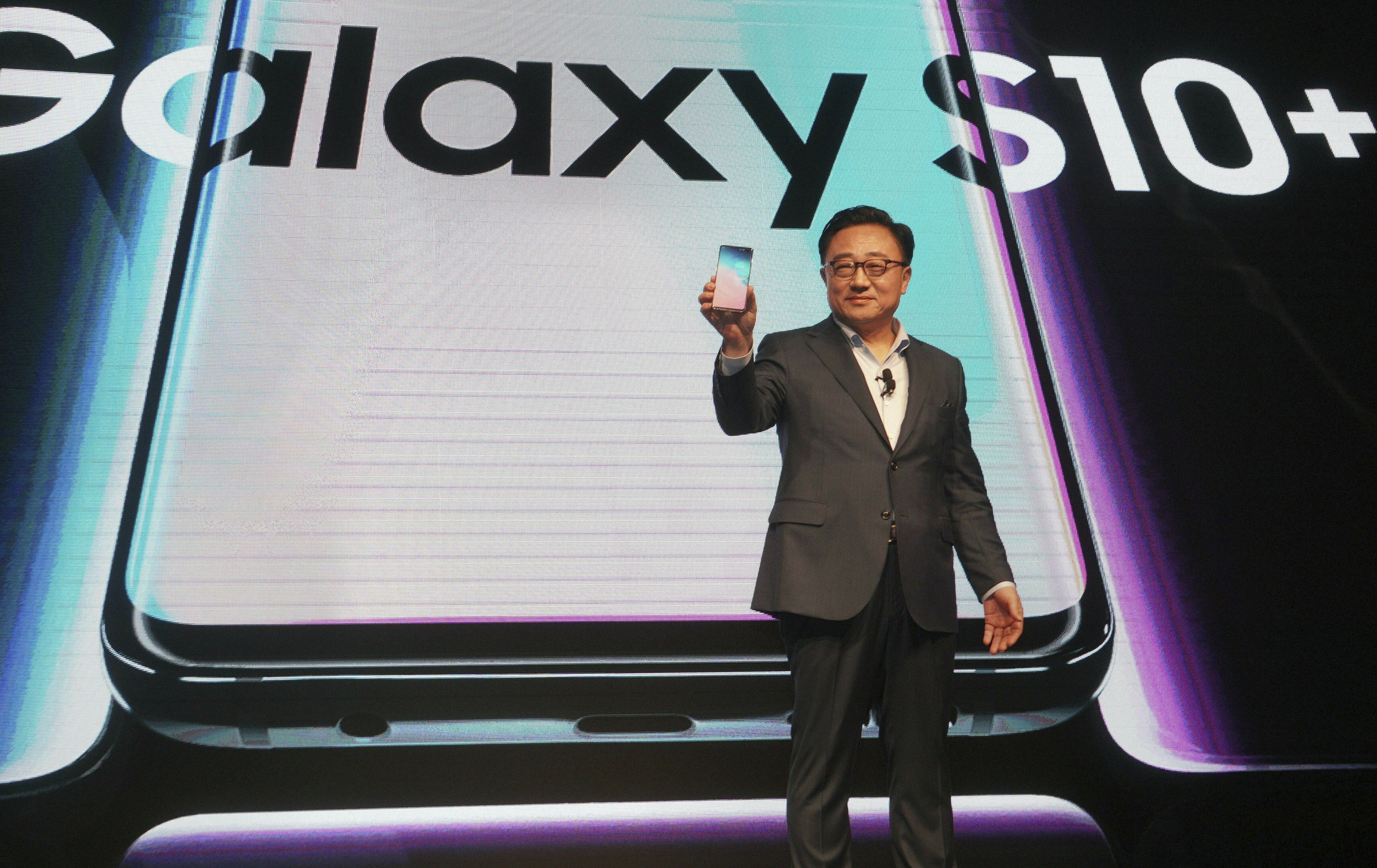 DJ Koh, president and CEO of IT & Mobile Communications Division, Samsung Electronics, launches the new Samsung Galaxy S10+ mobile phone, at a press conference in New Delhi - PTI