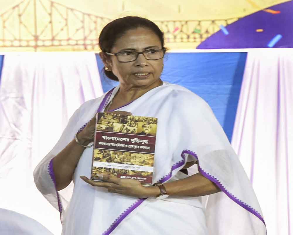 est Bengal Chief Minister Mamata Banerjee launches a book on Bangladesh War during Platinum Jubilee celebration of Kolkata Press Club, in Kolkata - PTI