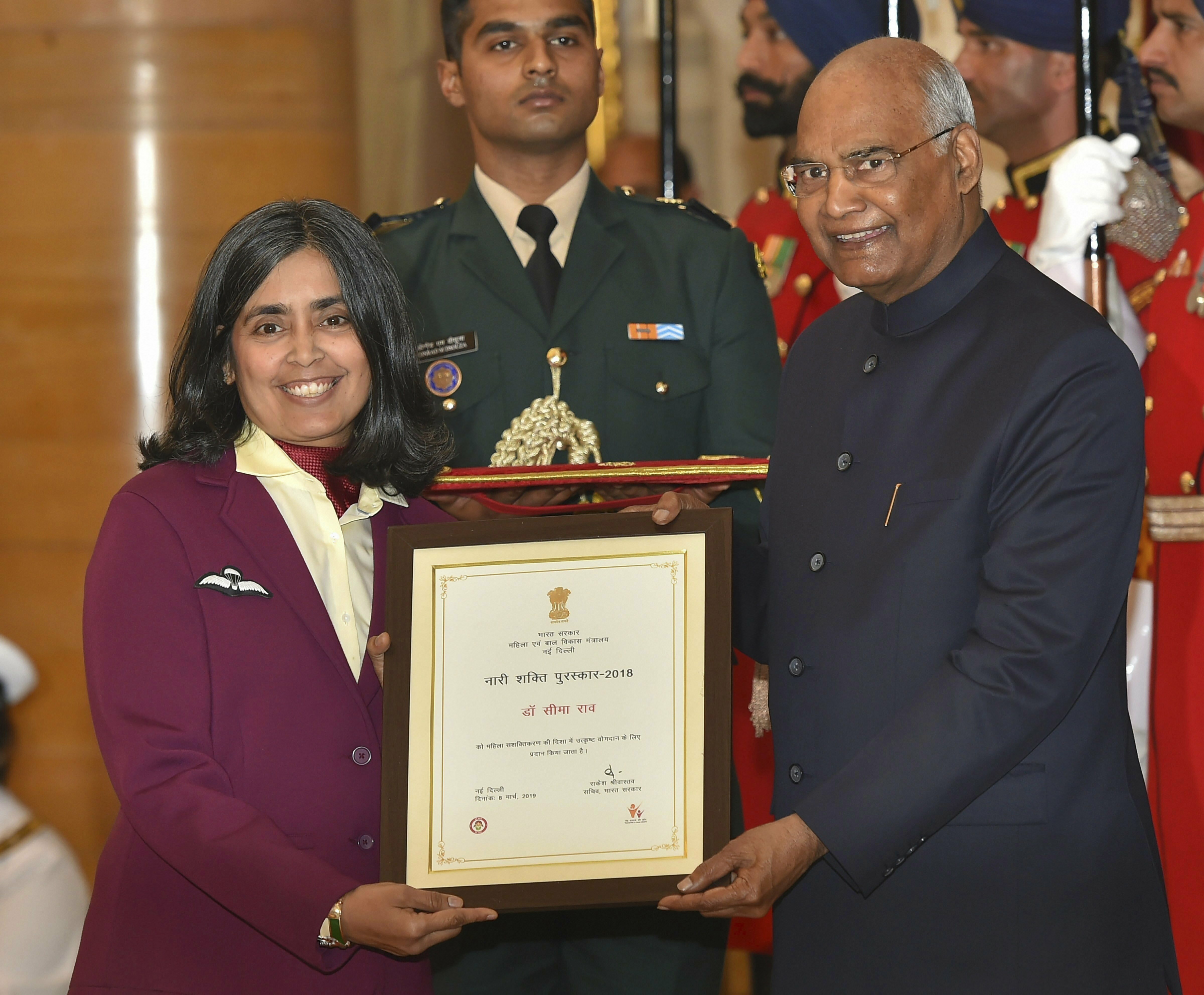 President Ram Nath Kovind presents an award to Seema Rao, the only woman commando trainer in India, during 'Nari Shakti Puraskar 2018' to mark International Women's Day, at Rashtrapati Bhawan in New Delhi- AP