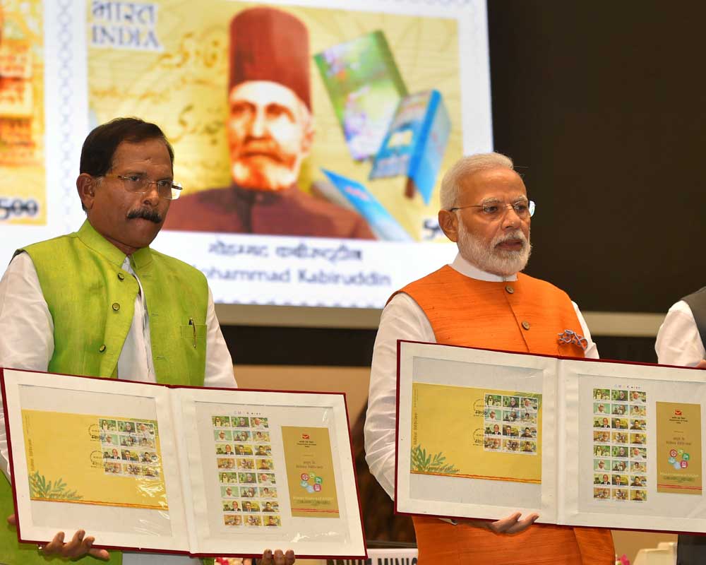 Prime Minister Narendra Modi along with Union Minister of State for AYUSH Shripad Yesso Naik releases commemorative stamps on 'Master Healers of AYUSH' during a function in New Delhi - PTI