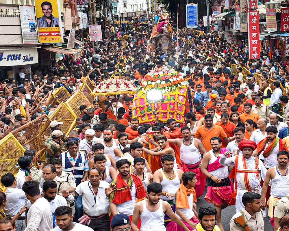 Shiv devotees participate in the holy procession 'Mahakal ki Sawari' taken out on the second Somwar (Monday) of the holy month of Sawan, in Ujjain, Madhya Pradesh – PTI