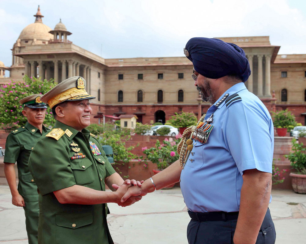 Chief of the Air Staff, Air Chief Marshal Birender Singh Dhanoa welcomes Myanmar's Commander-In-Chief of Defence Services Senior General Min Aung Hlaing at South Block in New Delhi - PTI