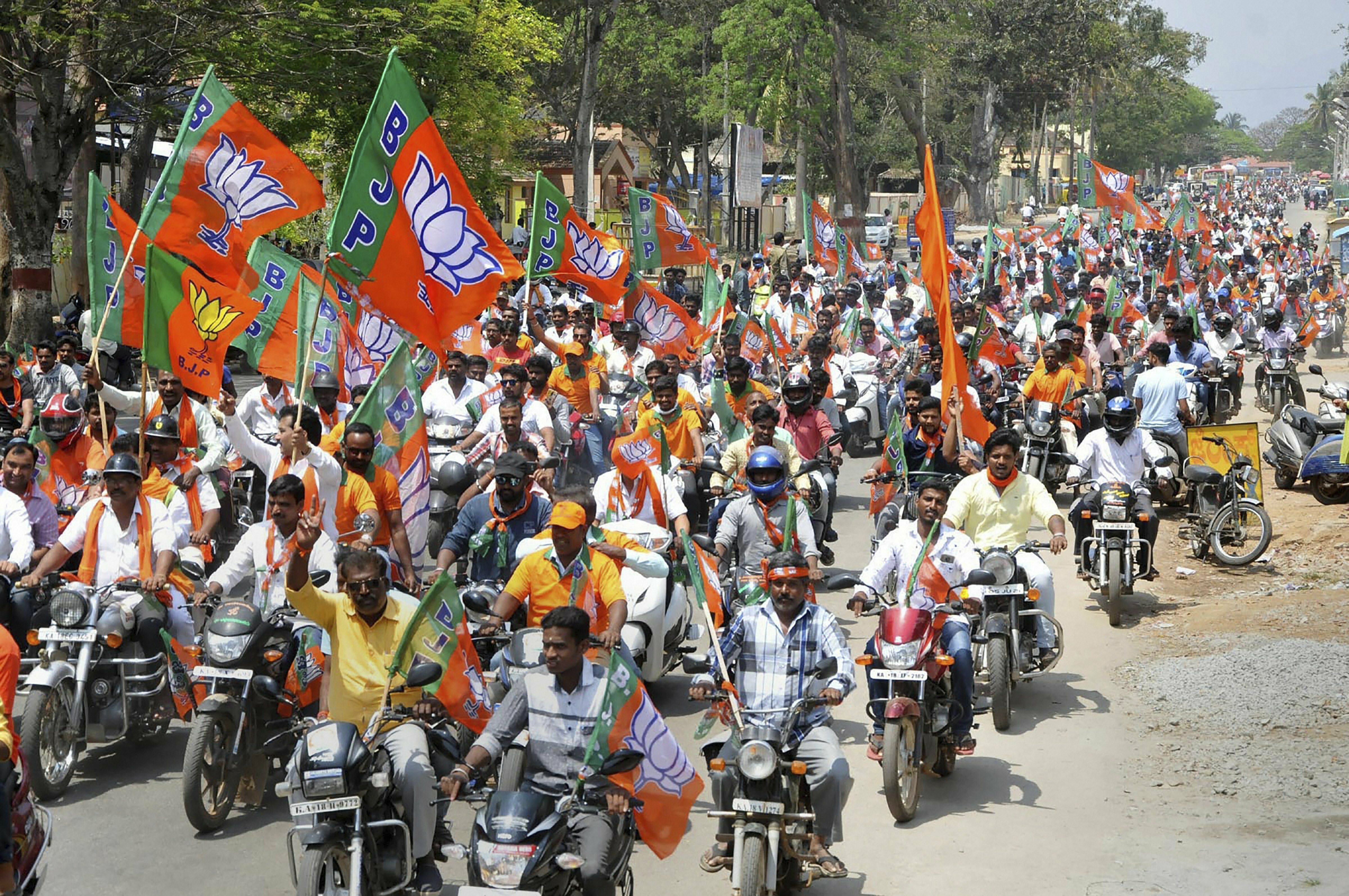 BJP activists carry out a bike rally during 'Vijay Sankalp Yatra', for upcoming Lok Sabha election, in Chikmagalur - PTI