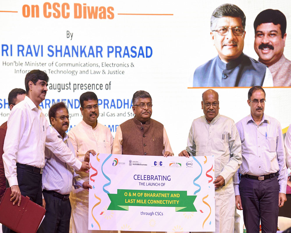 Union Communications and IT Minister Ravi Shankar Prasad with Petroleum Minister Dharmendra Pradhan and Minister of State for IT Sanjay Shamrao Dhotre during CSC Women Village Level Entrepreneurs (VLEs) workshop on Common Services Centres (CSC) Day - PTI