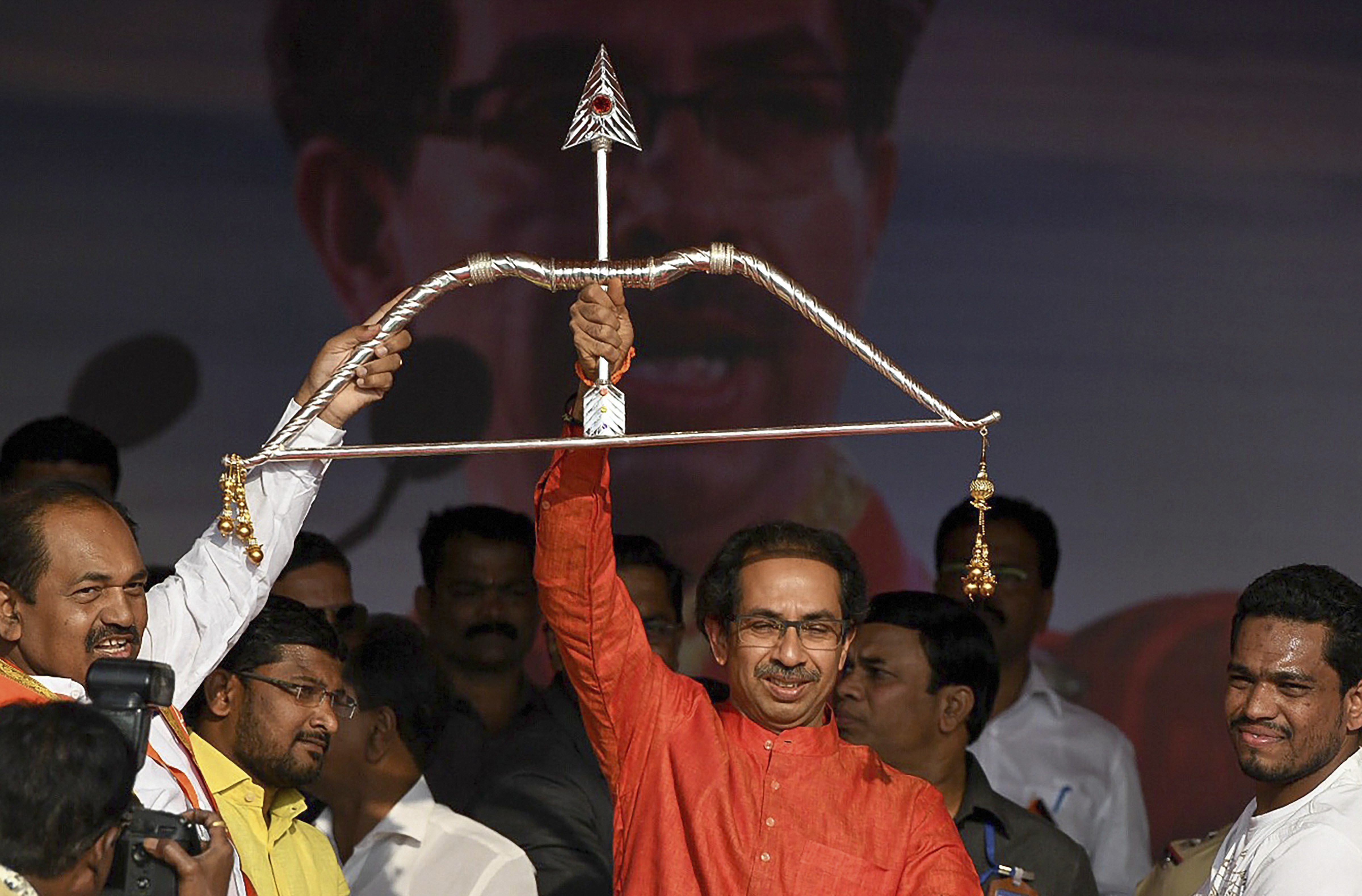 Shiv Sena chief Uddhav Thackeray being presented a bow and arrow, the party symbol, at a rally at Pandharpur in Maharashtra - PTI