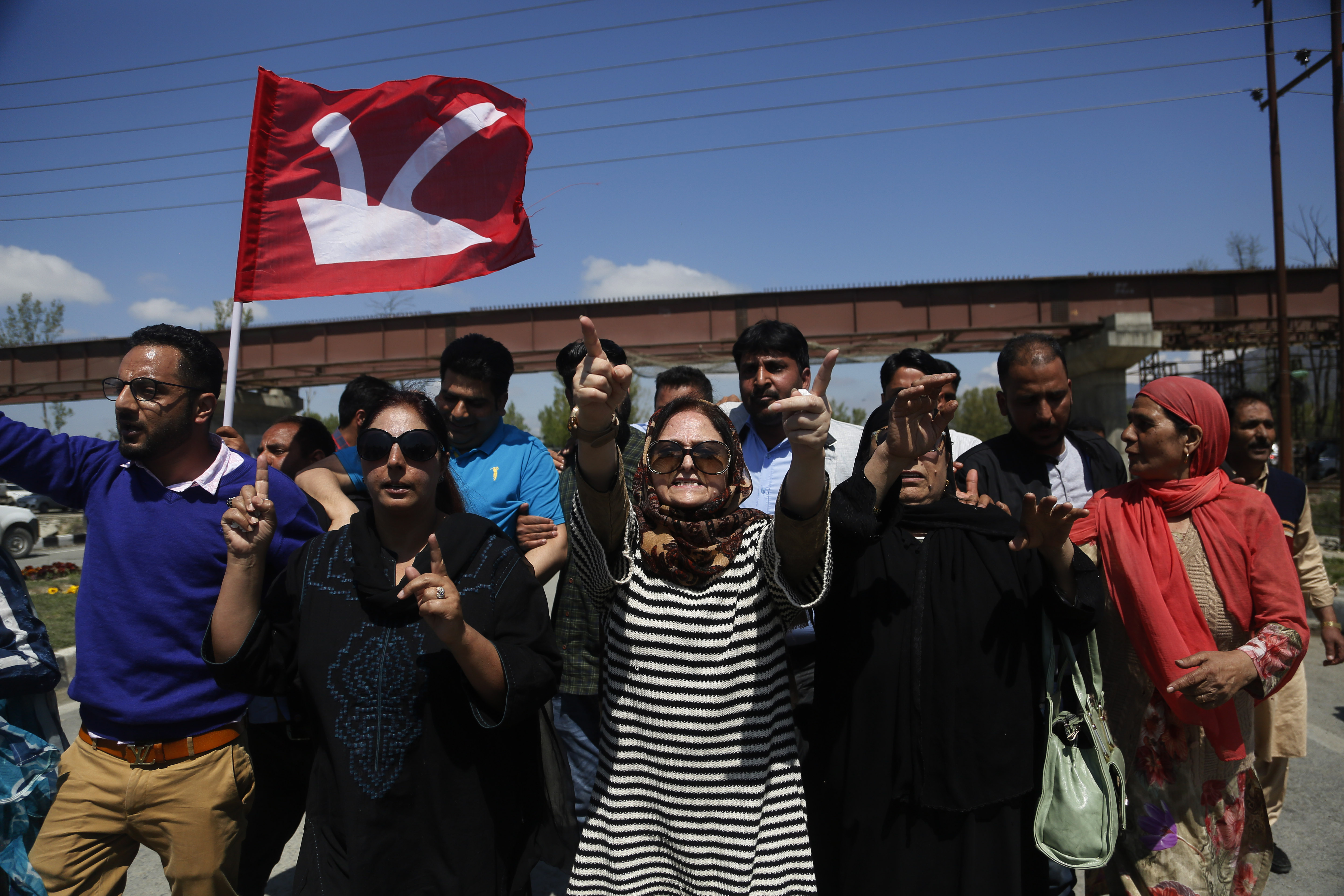 Supporters of former Jammu and Kashmir chief minister and National Conference (NC) leader Omar Abdullah shout slogans during a protest against a twice-weekly ban on the movement of civilian vehicles on a key highway on the outskirts of Srinagar - AP