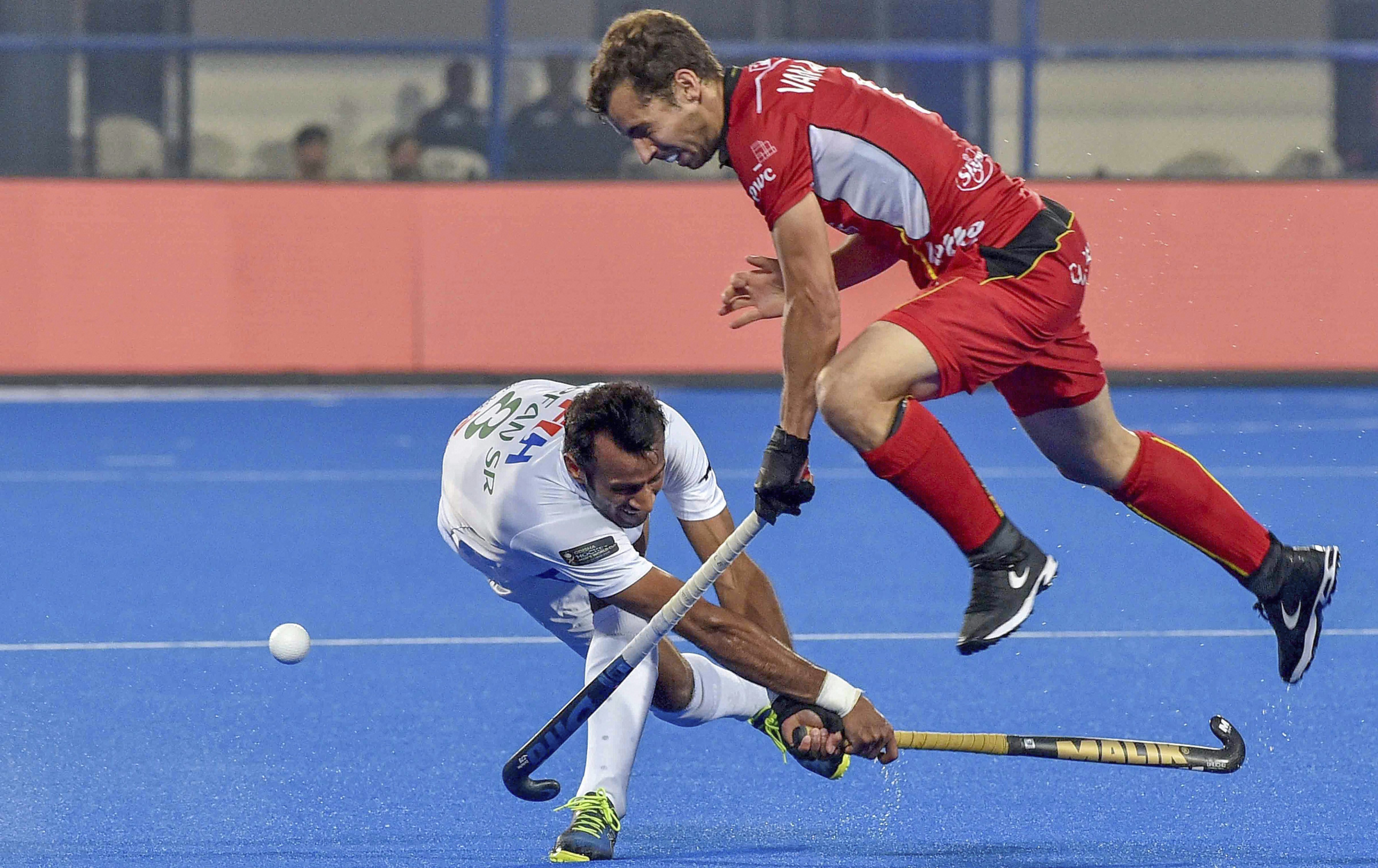 Belgium's Aubel Van (in red) and Pakistan's Muhammad Irfan vie for the ball, at the Men's Hockey World Cup 2018, in Bhubaneswar - PTI
