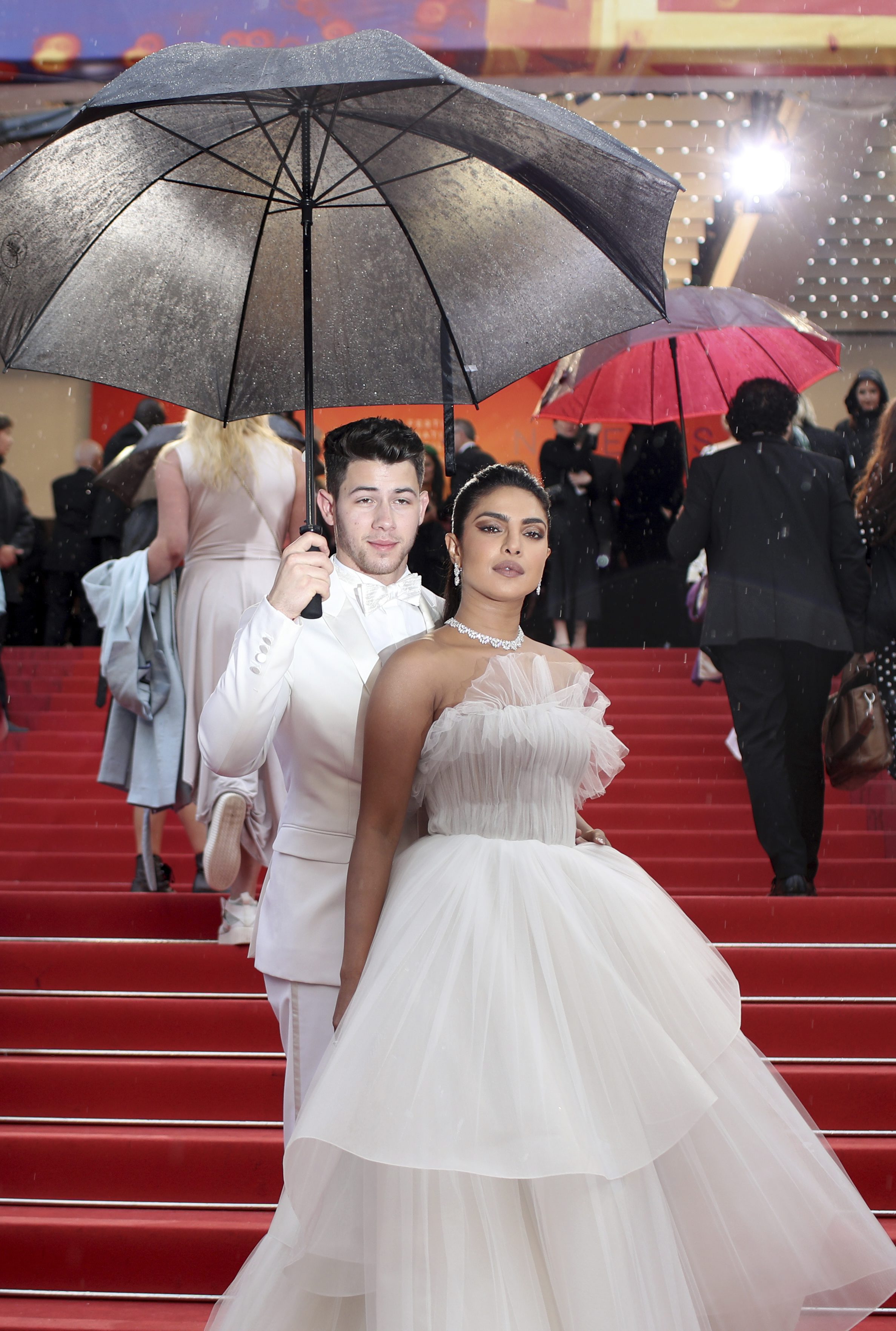 Actress Priyanka Chopra, front, and singer Nick Jonas pose for photographers upon arrival at the premiere of the film 'The Best Years of a Life' at the 72nd international film festival, Cannes, southern France - PTI