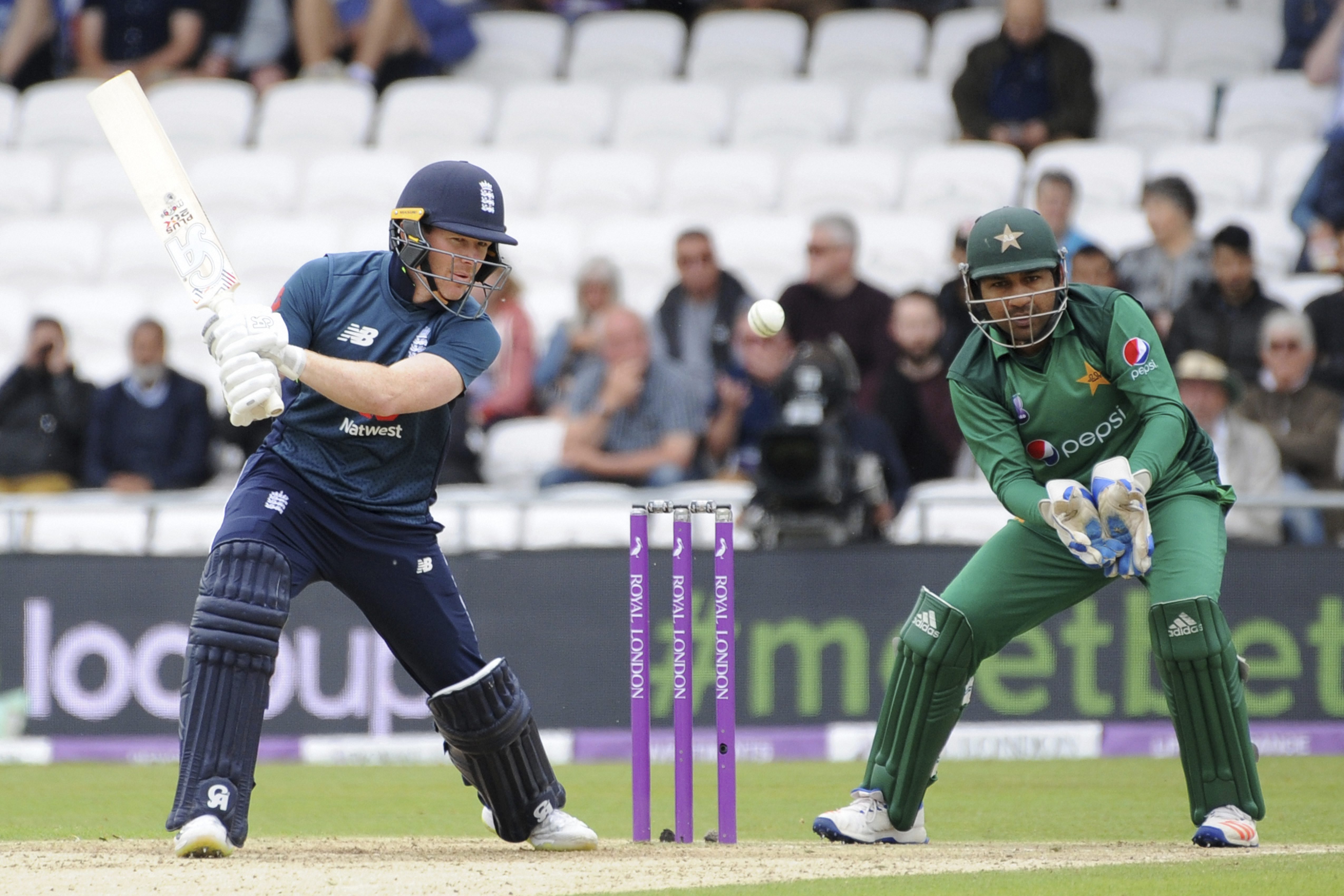 England's Eoin Morgan, left, plays a shot while Pakistan's wicketkeeper Sarfraz Ahmed tries to catch the ball during the Fifth One Day International cricket match between England and Pakistan at Emerald Headingley in Leeds, England - PTI
