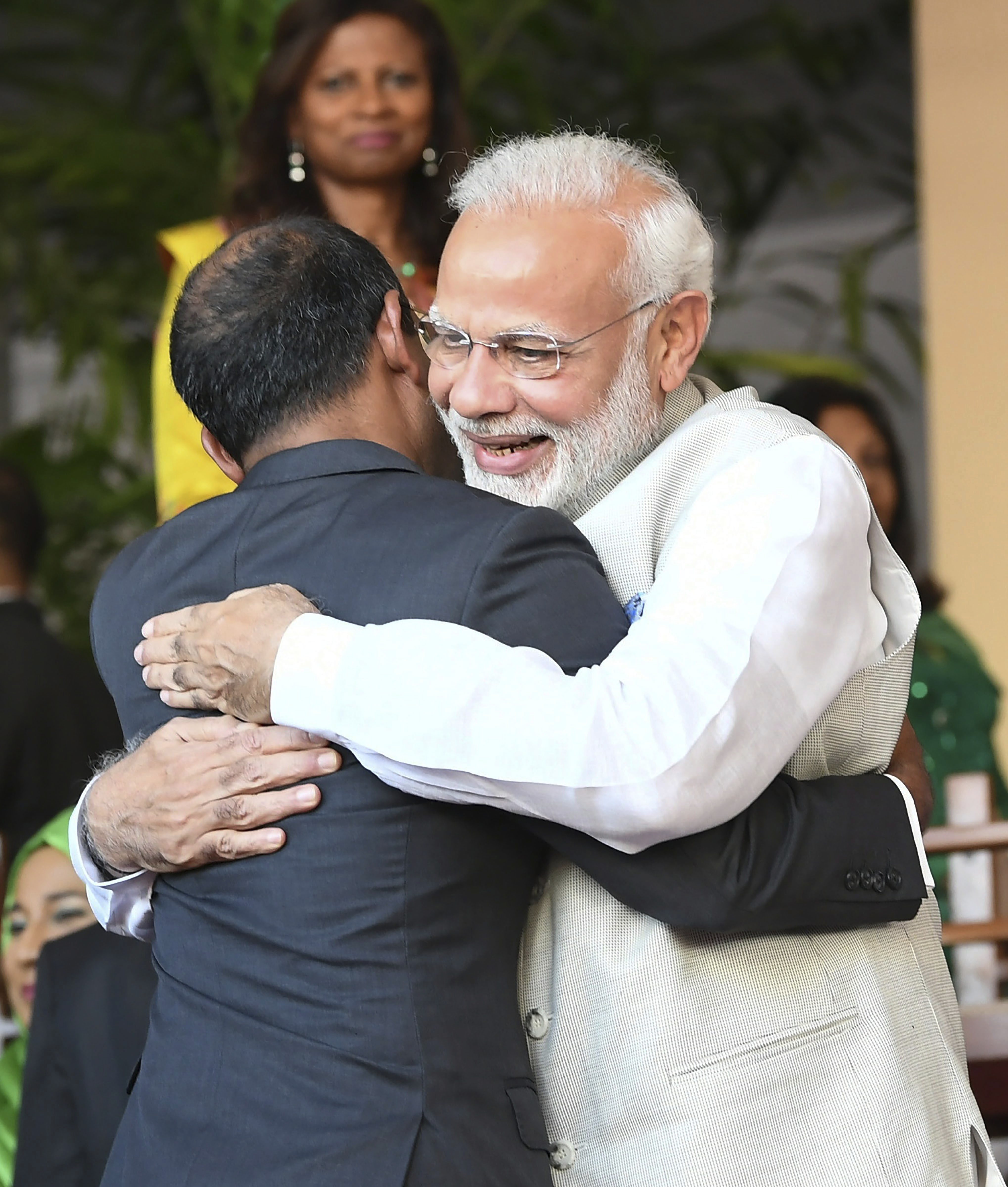 Prime Minister Narendra Modi exchanges greetings with a dignitary during the swearing-in ceremony of President-elect Ibrahim Mohamed Solih, in Male, Maldives - PTI