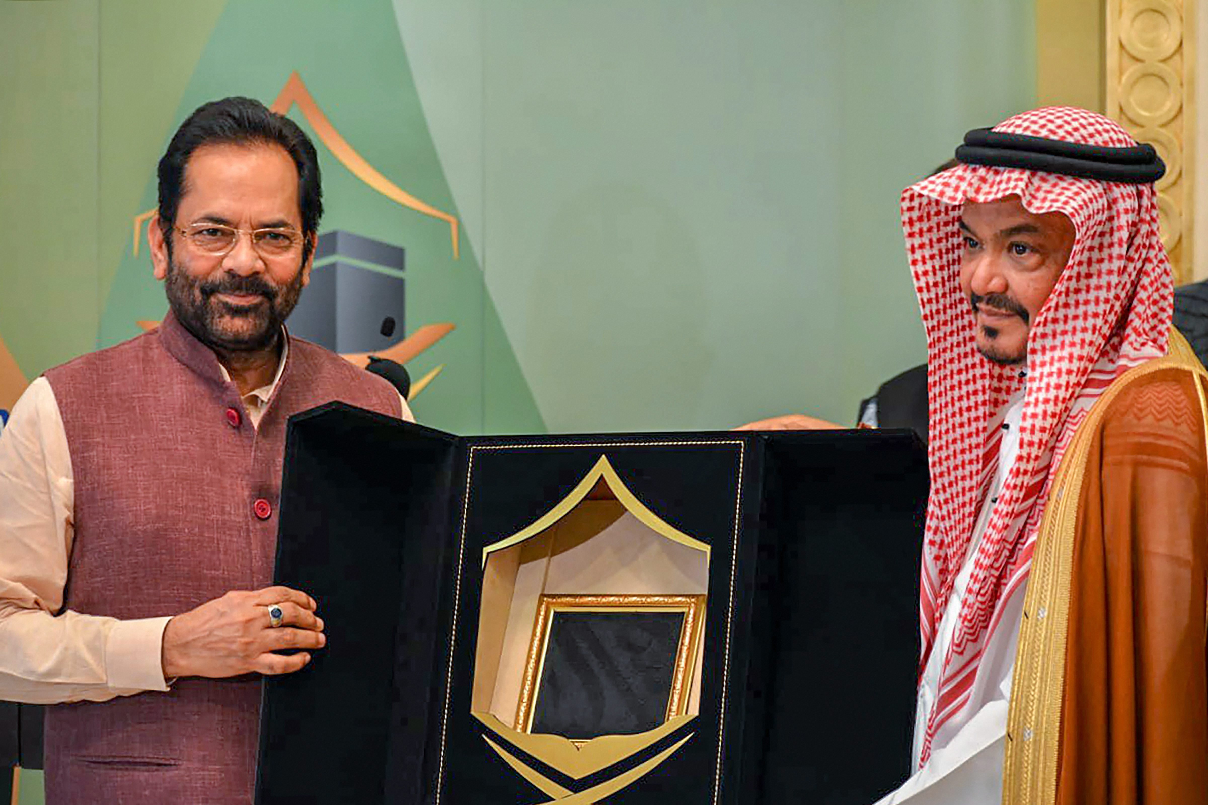 Minister for Minority Affairs Mukhtar Abbas Naqvi with Minister of Haj and Umrah Dr. Mohammad Saleh Bin Taher Benten after signing a bilateral annual Haj 2019 agreement between India and Saudi Arabia, in Jeddah - PTI