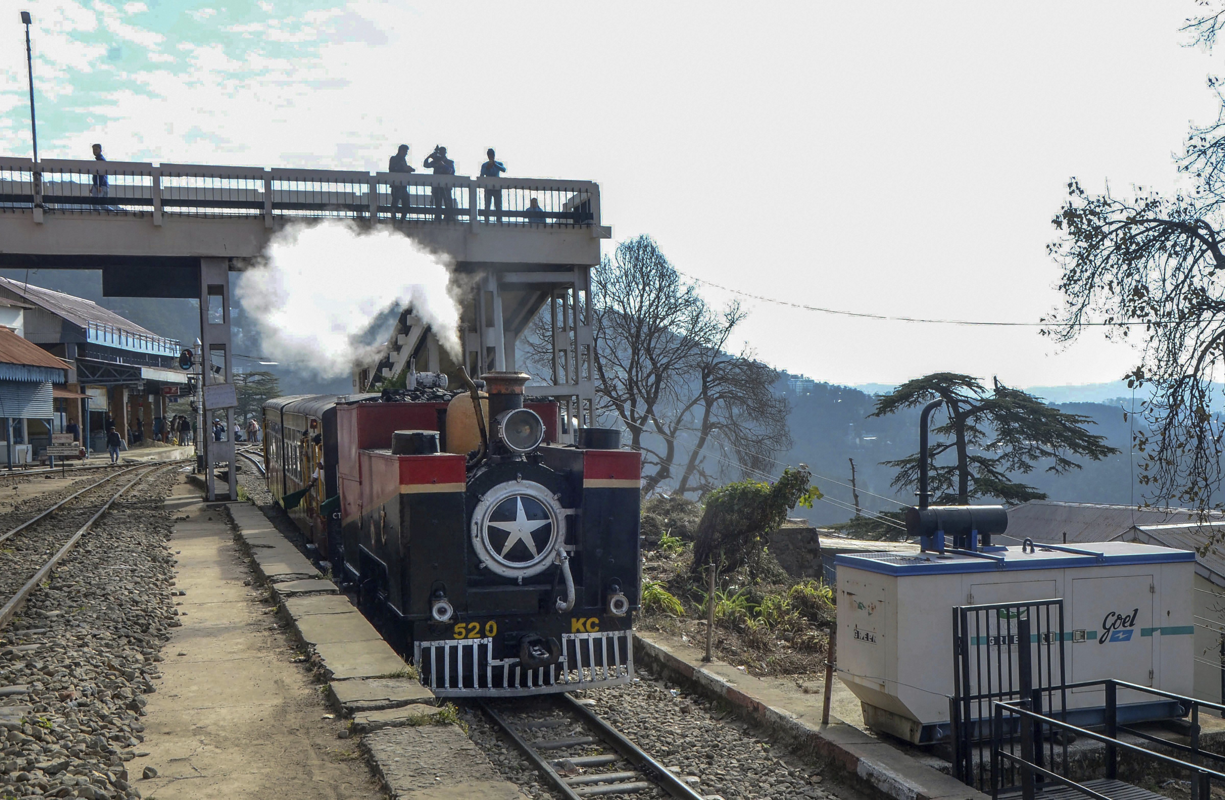 A 1905 British-built steam engine, the only existing narrow-gauge steam engine, runs on Kalka-Shimla UNESCO World Heritage railway tracks in Shimla - PTI
